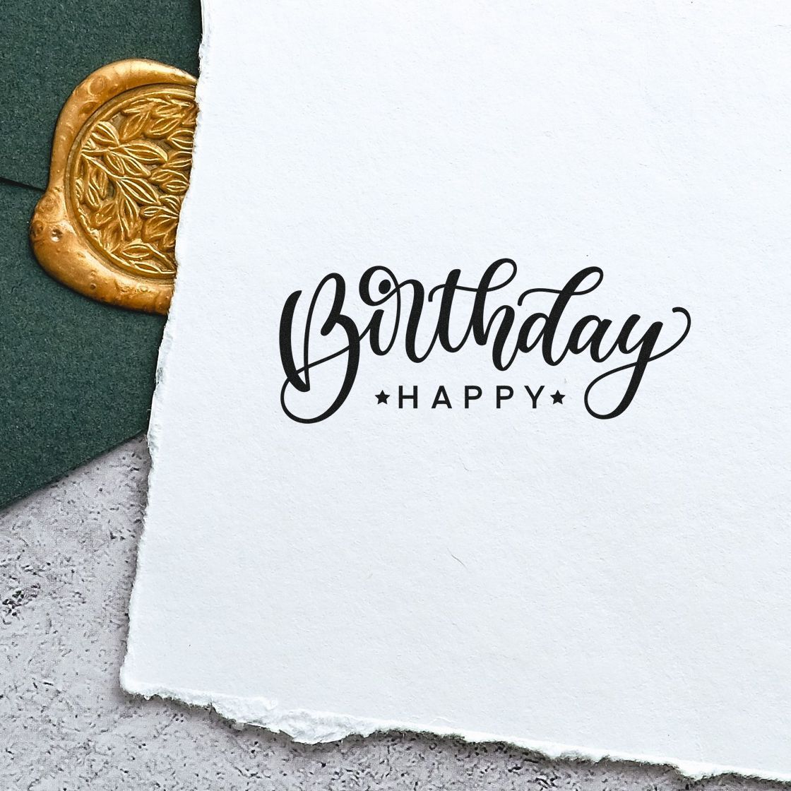 Birthday Happy Reversed Layout Premium Wooden Stamp - Vintage Pro imprint stamped in black ink. A large looping Birthday script sits above small spaced HAPPY capitals.