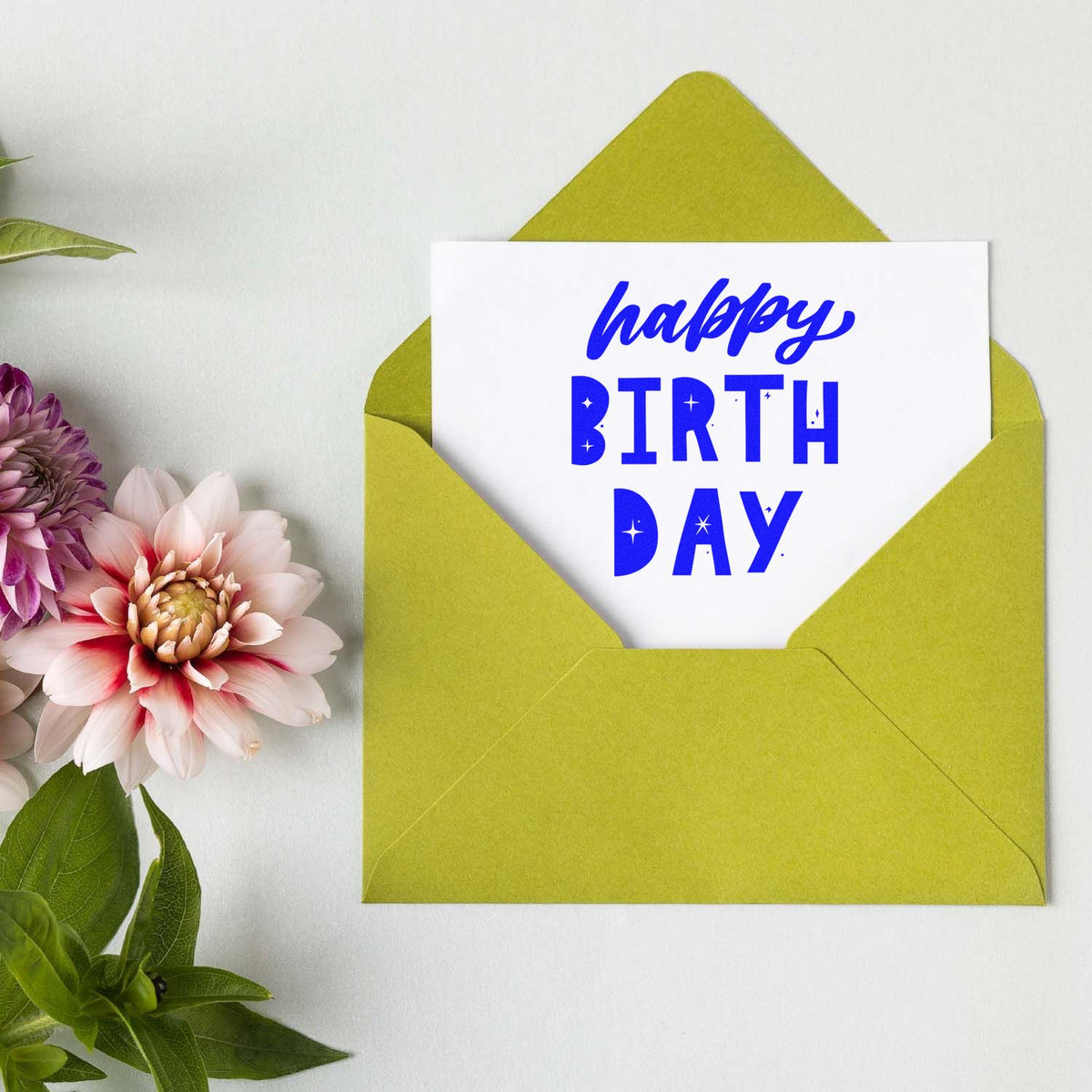 Happy Birthday Star Cutouts rubber stamp shown in blue ink, stamped for projects such as drive in album page.