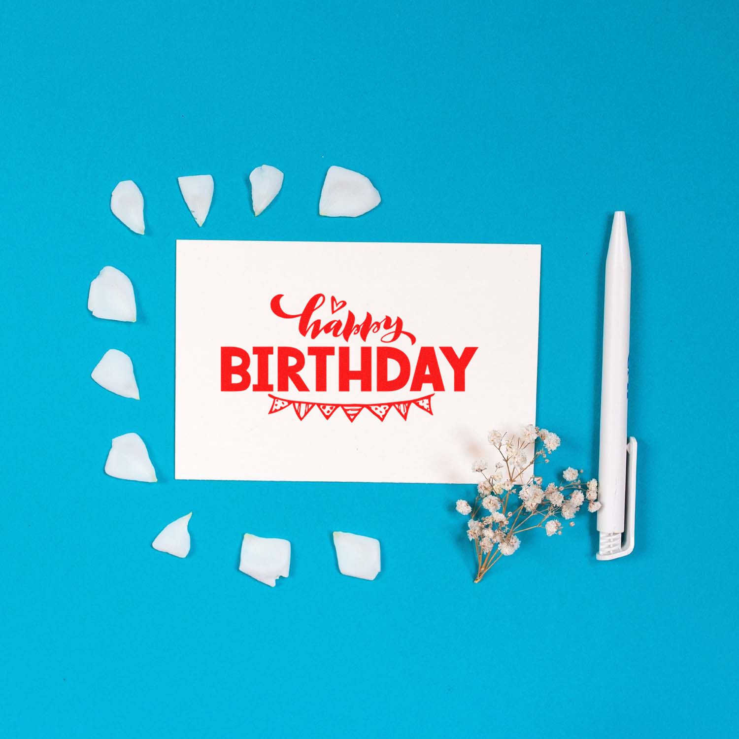 Happy Birthday rubber stamp impression on card with stamp tool, ideal for handmade birthday cards and craft projects.