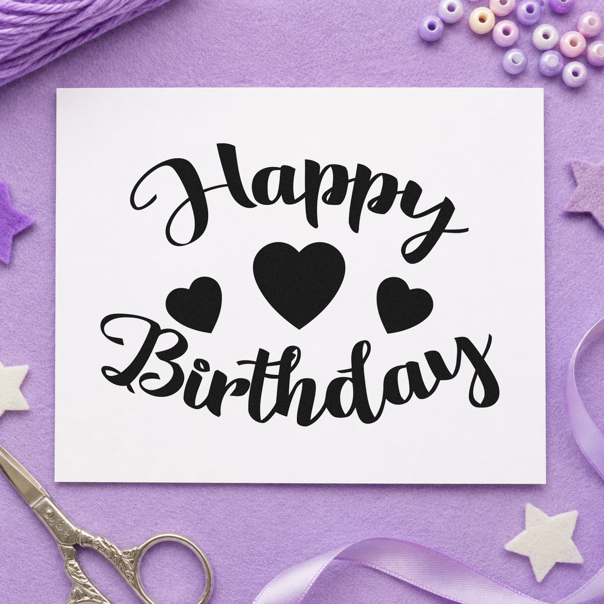 Happy Birthday Three Hearts craft stamp imprint in black ink on a handmade project, one idea being print set gift tags.