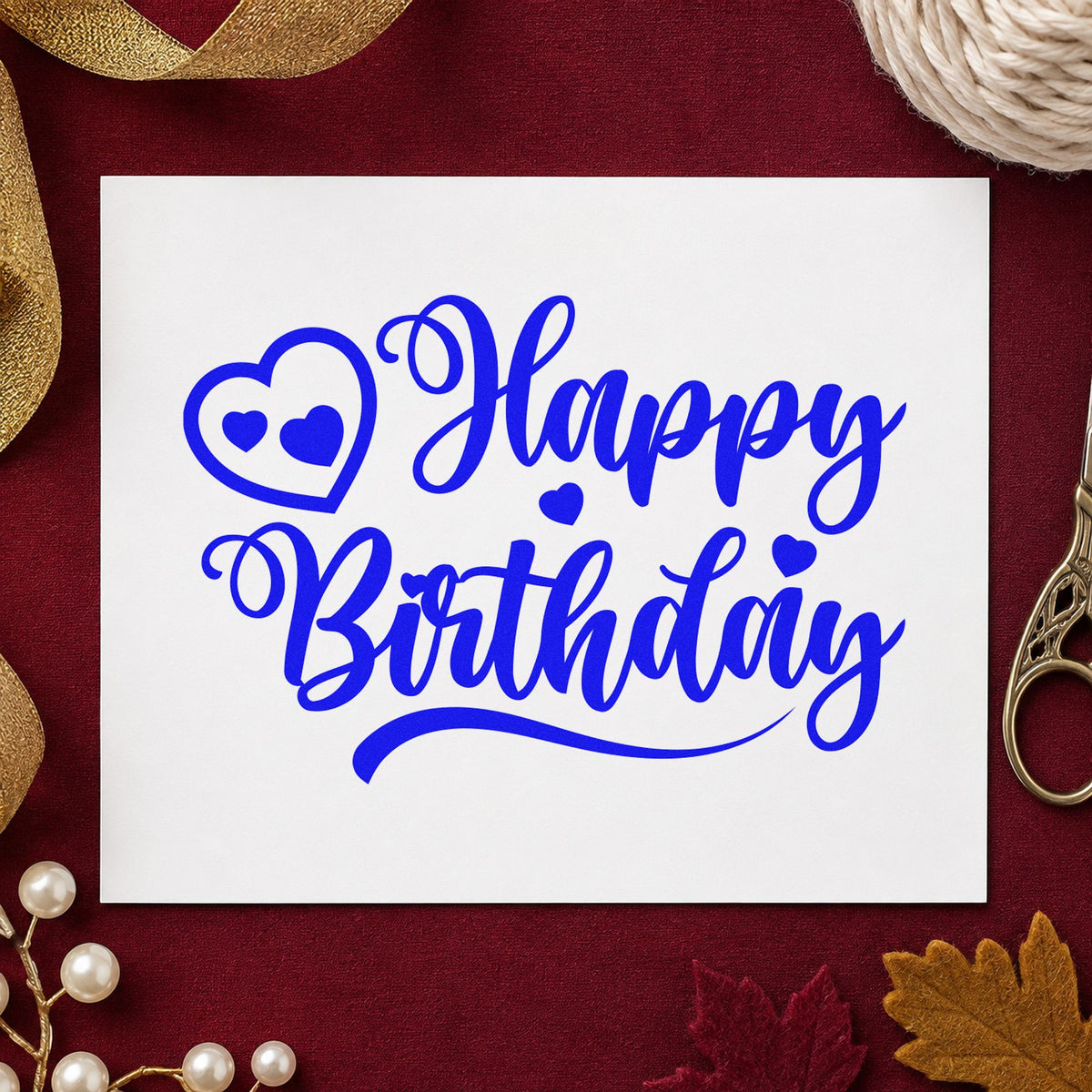 Happy Birthday Heart Swirl craft stamp in blue ink on cardstock, an easy option for lap quilt printing.