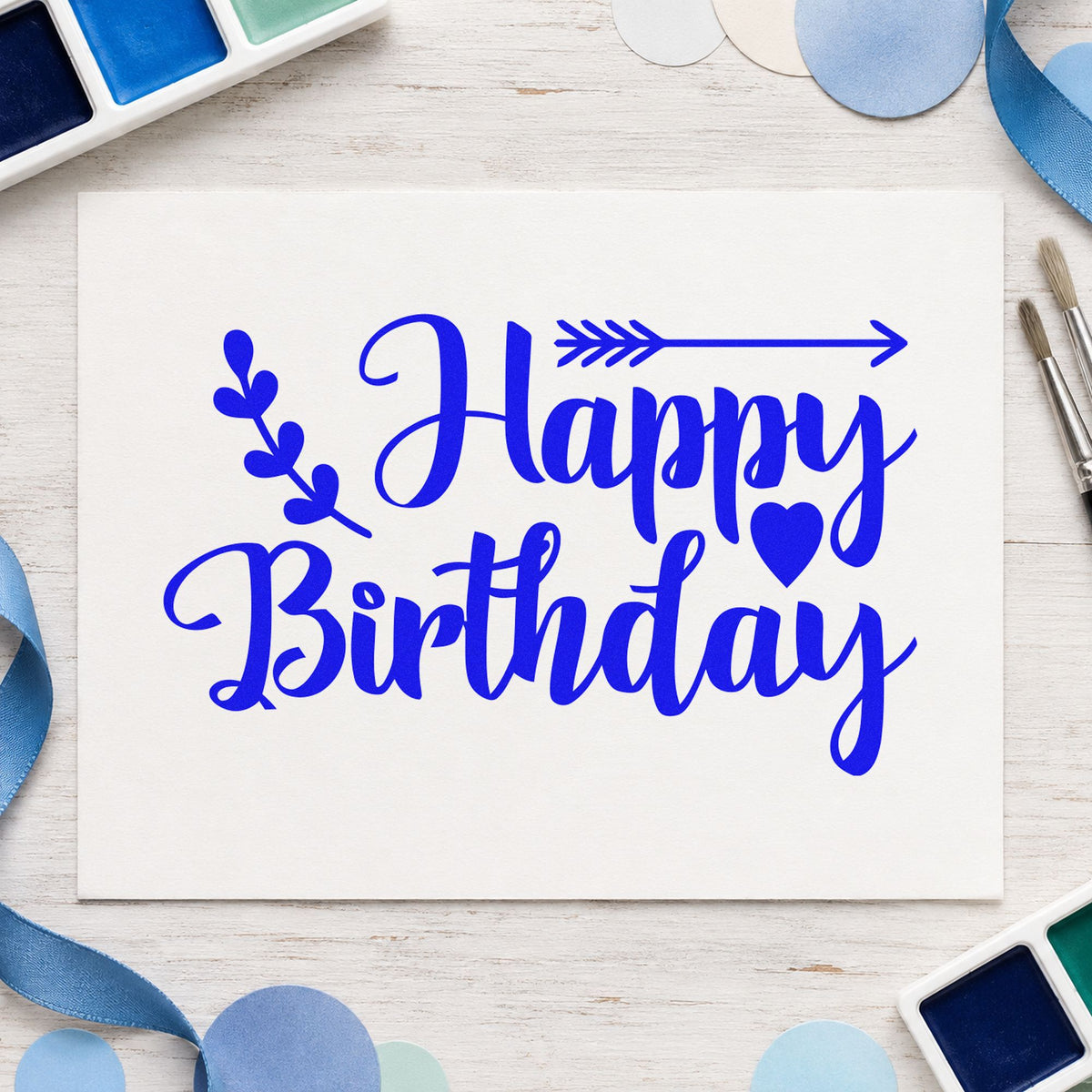 Birthday Arrow Leaf Hearts craft stamp in blue ink on cardstock, an easy option for buff band printing.