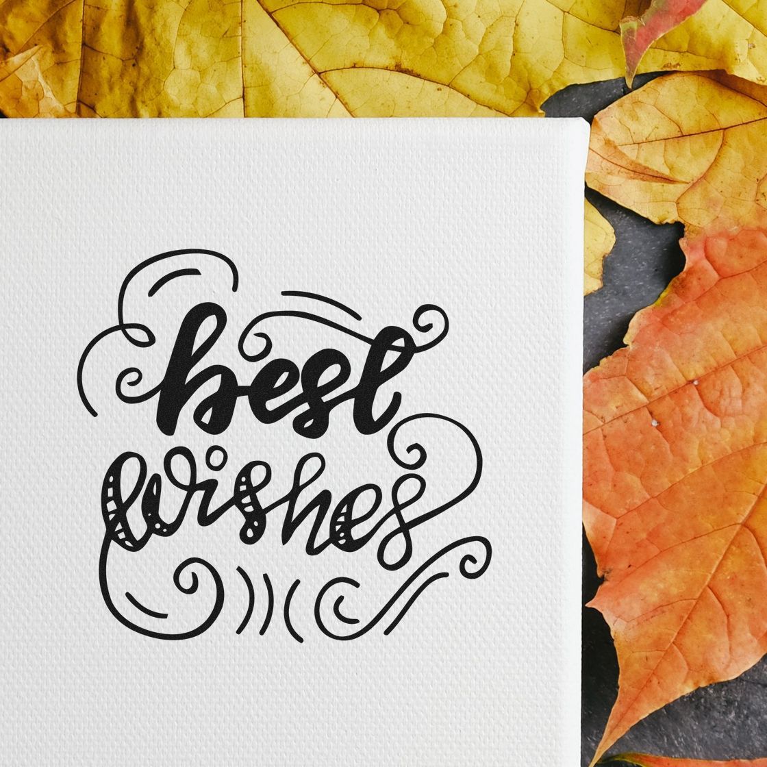 Best Wishes Curled Flourishes Premium Wooden Stamp - Vintage Pro imprint stamped in black ink. best wishes appears in bold flowing script surrounded by decorative curls.
