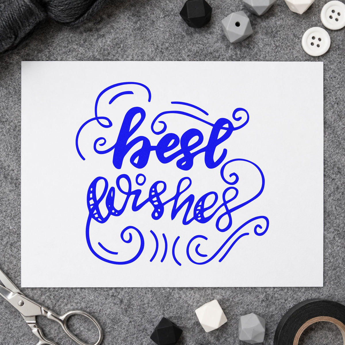 Best Wishes Curled Flourishes craft stamp in blue ink on cardstock, an easy option for break room printing.