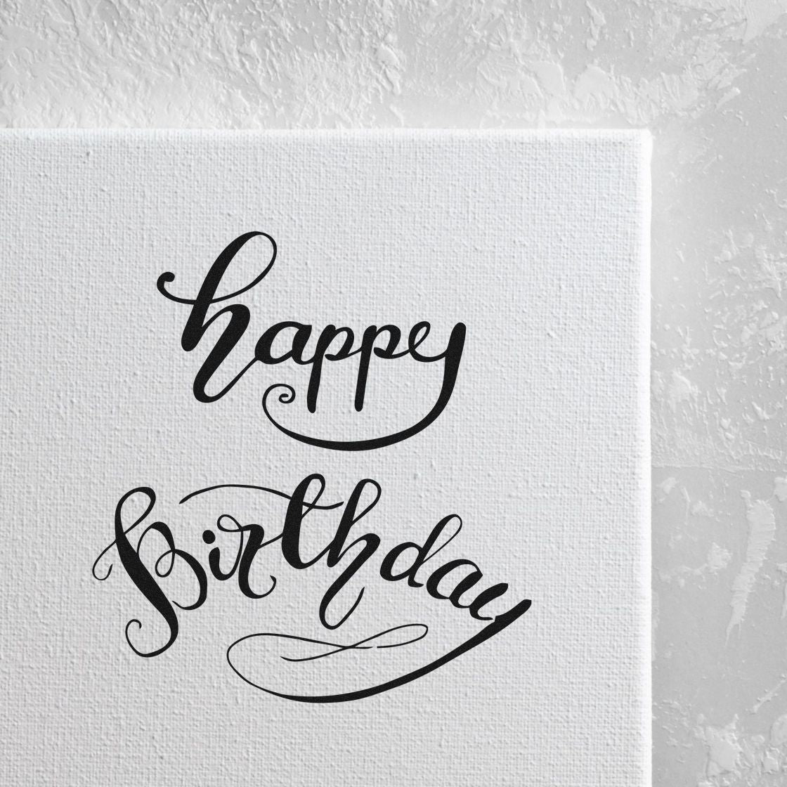 Happy Birthday Curved Script Lettering Stamp - Premium Vintage Pro Wooden imprint stamped in black ink. happy birthday appears in two lines of graceful script with curved flourishes and an arched lower word.