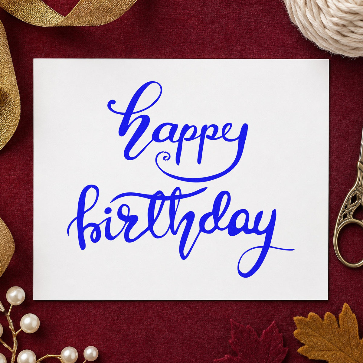 Happy Birthday Fine Flourishes craft stamp in blue ink on cardstock, an easy option for packing cloth printing.