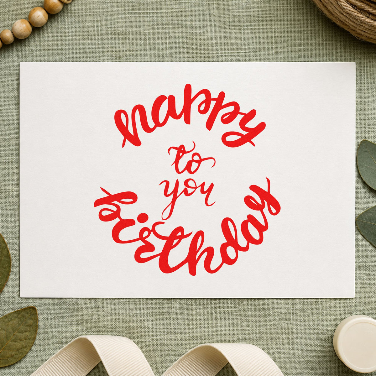 Happy Birthday Circular Script craft stamp imprint in red ink on a handmade project, one idea being table sign cards.