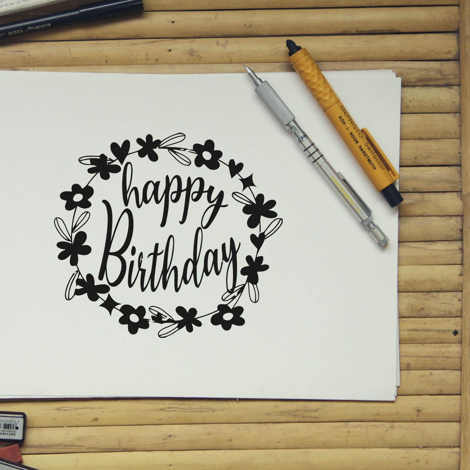 Happy Birthday floral wreath rubber stamp design on paper, ideal for handmade birthday card crafting and stamping.