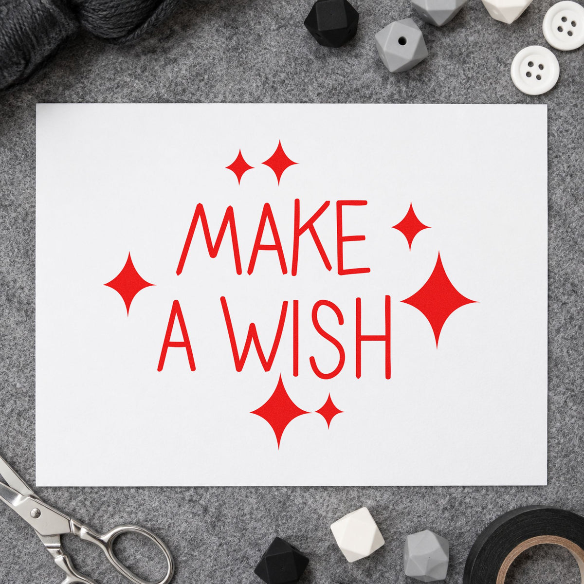 Make A Wish Sparkles rubber stamp shown in red ink, stamped for projects such as bin story labels.