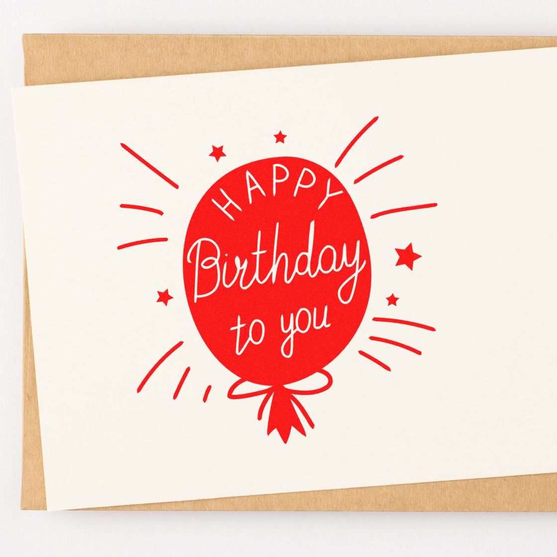 Happy Birthday to You rubber stamp design with red balloon and festive stars on cardstock.