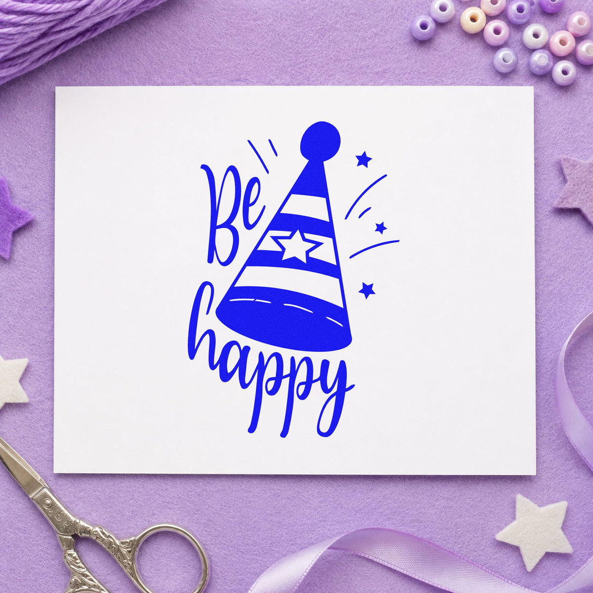 Be Happy Party Hat craft stamp in blue ink on cardstock, an easy option for desk mat printing.