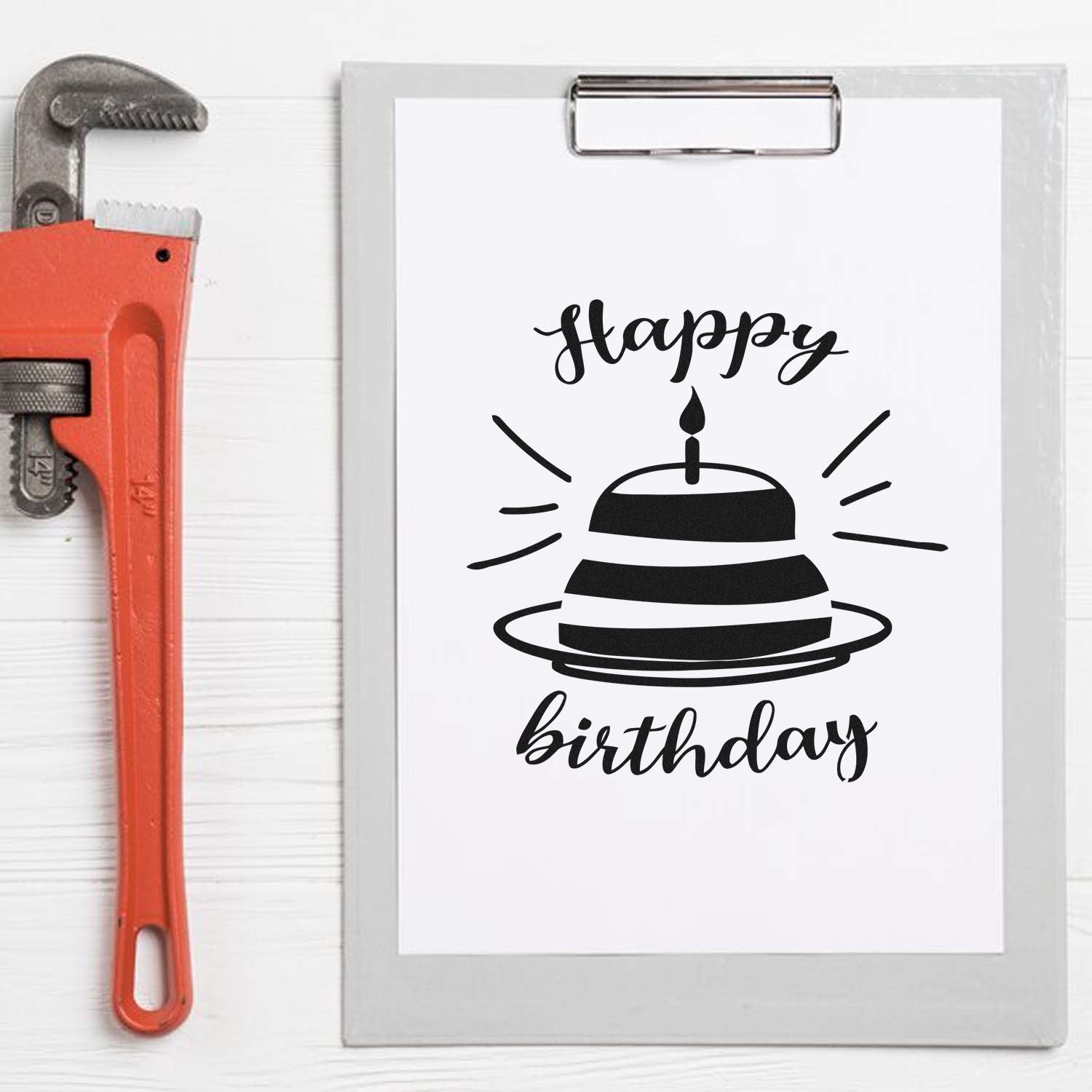 Happy birthday rubber stamp design with cake icon on clipboard, ideal for birthday card making, crafting, and custom stamp projects.