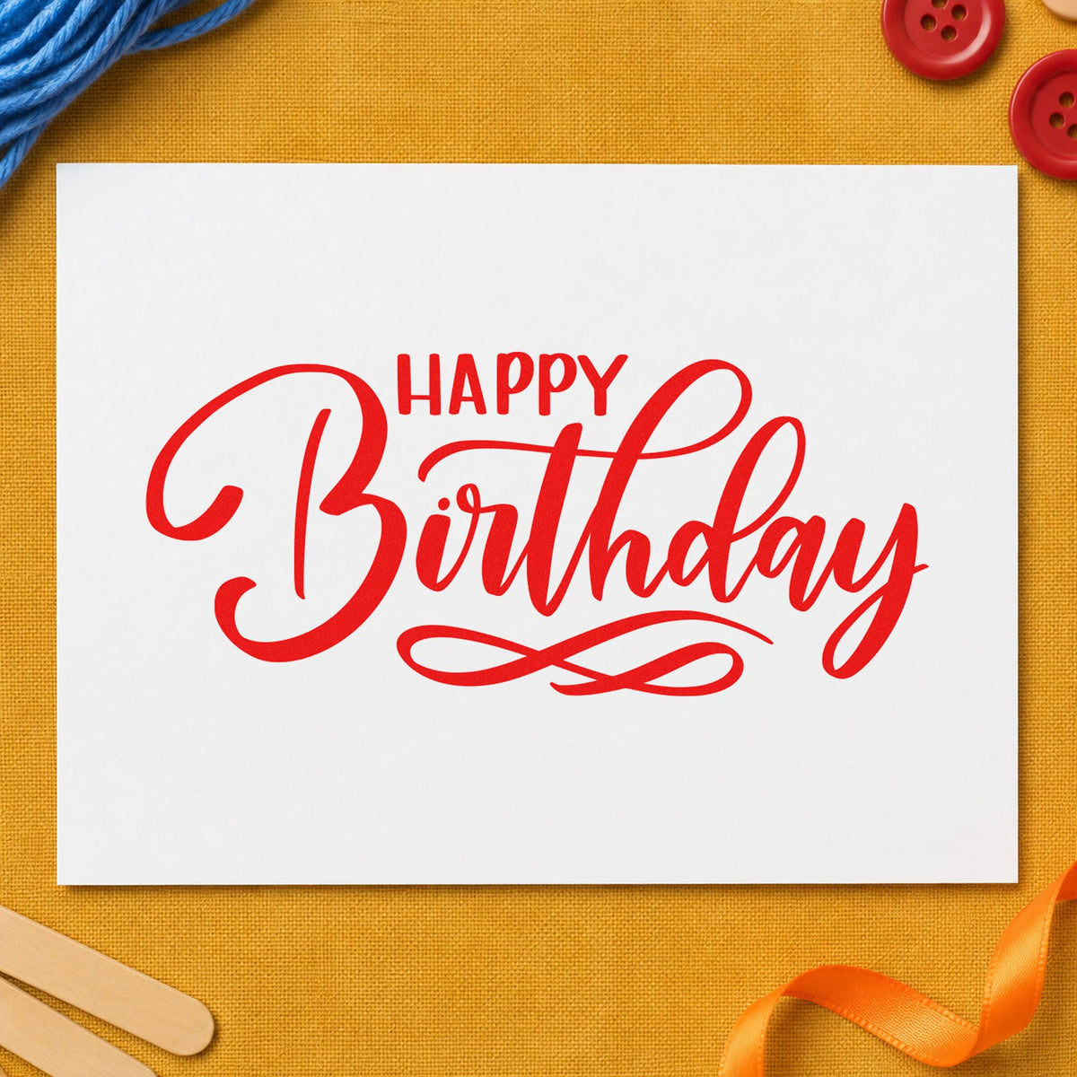 Happy Birthday Infinity Flourish rubber stamp shown in red ink, stamped for projects such as bin kit labels.