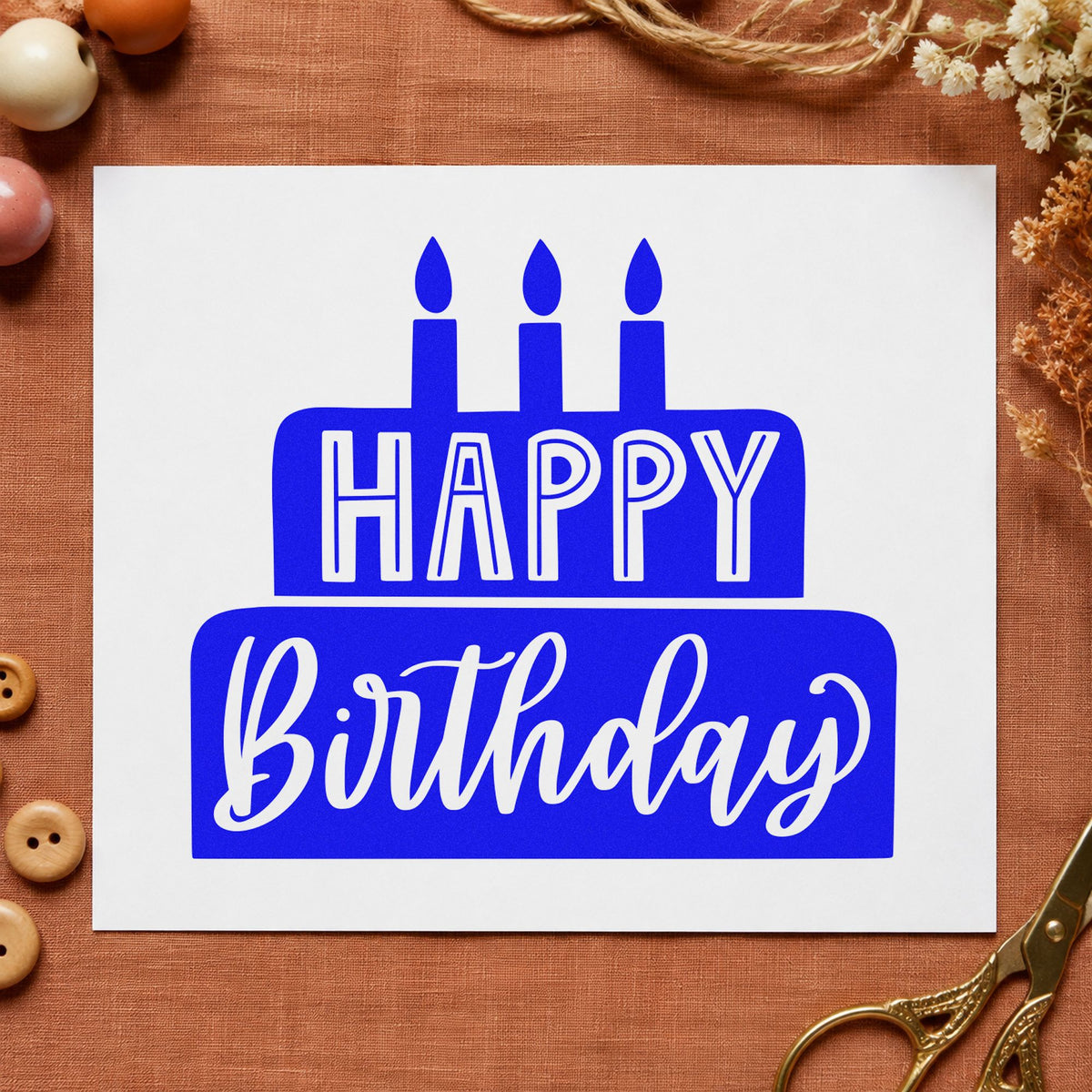 Happy Birthday Solid Cake craft stamp imprinted in blue ink on paper, a design suited to framed serving hatch.