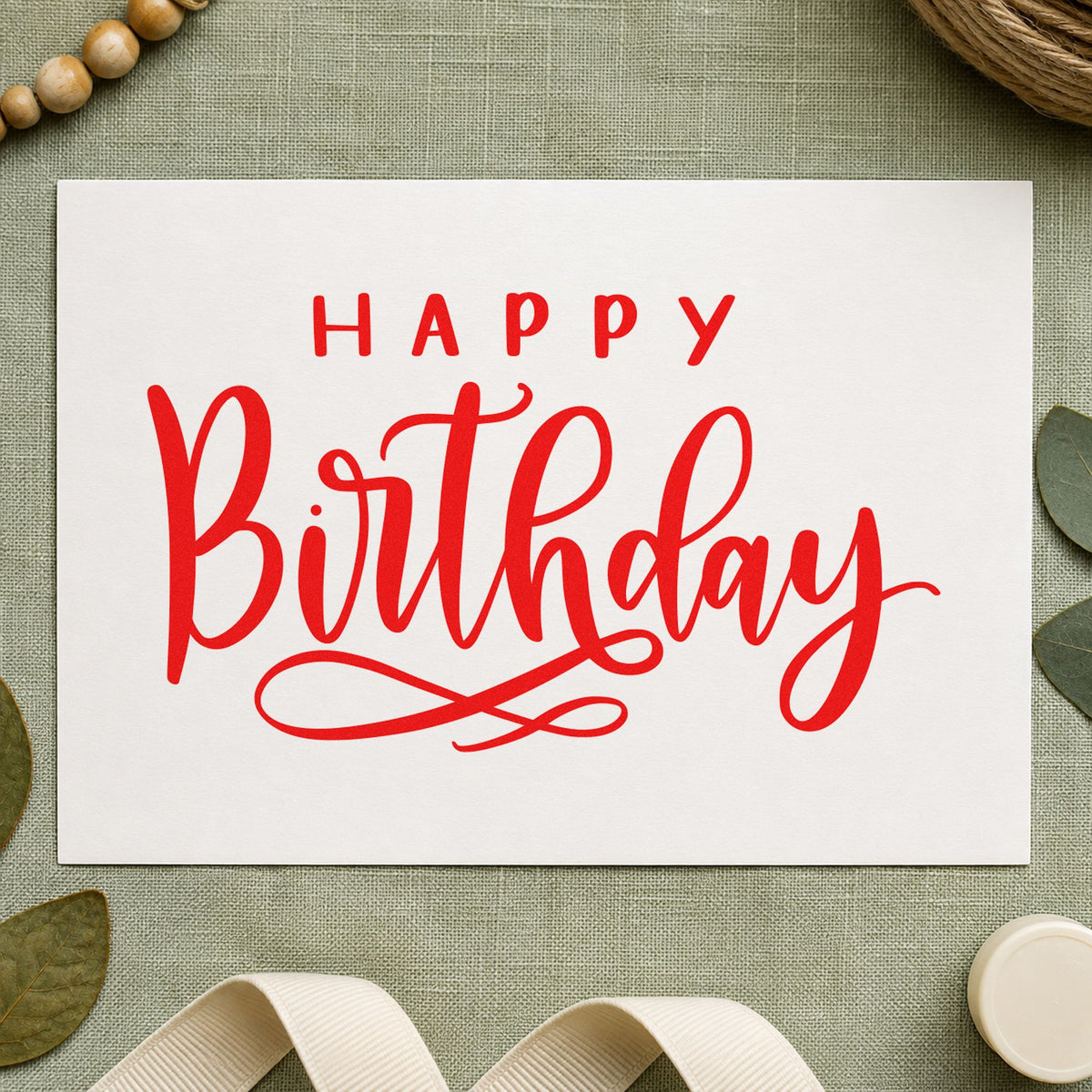 Happy Birthday Loop Underline craft stamp imprint in red ink on a handmade project, one idea being family sign cards.