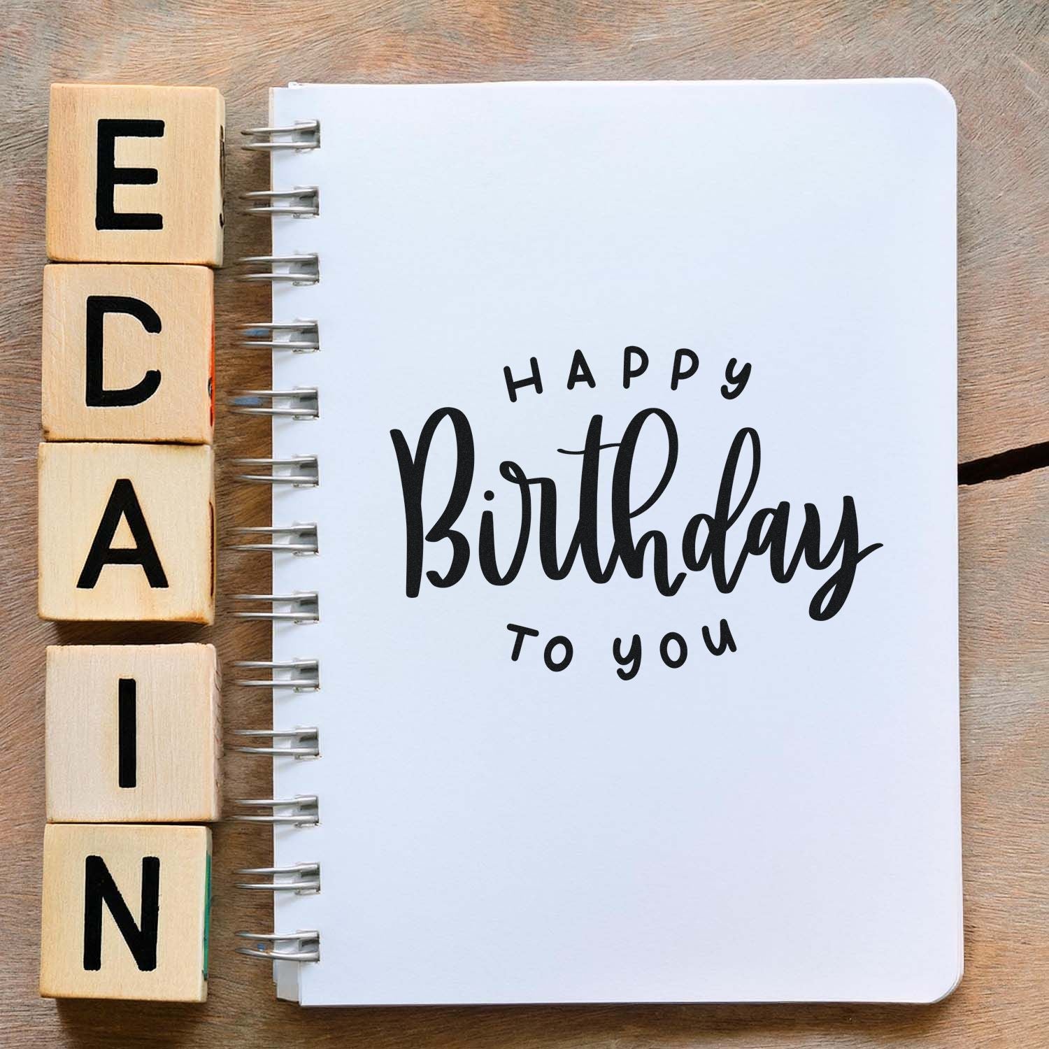 Happy Birthday to you rubber stamp design on a notebook page, perfect for handmade birthday cards and scrapbooking.