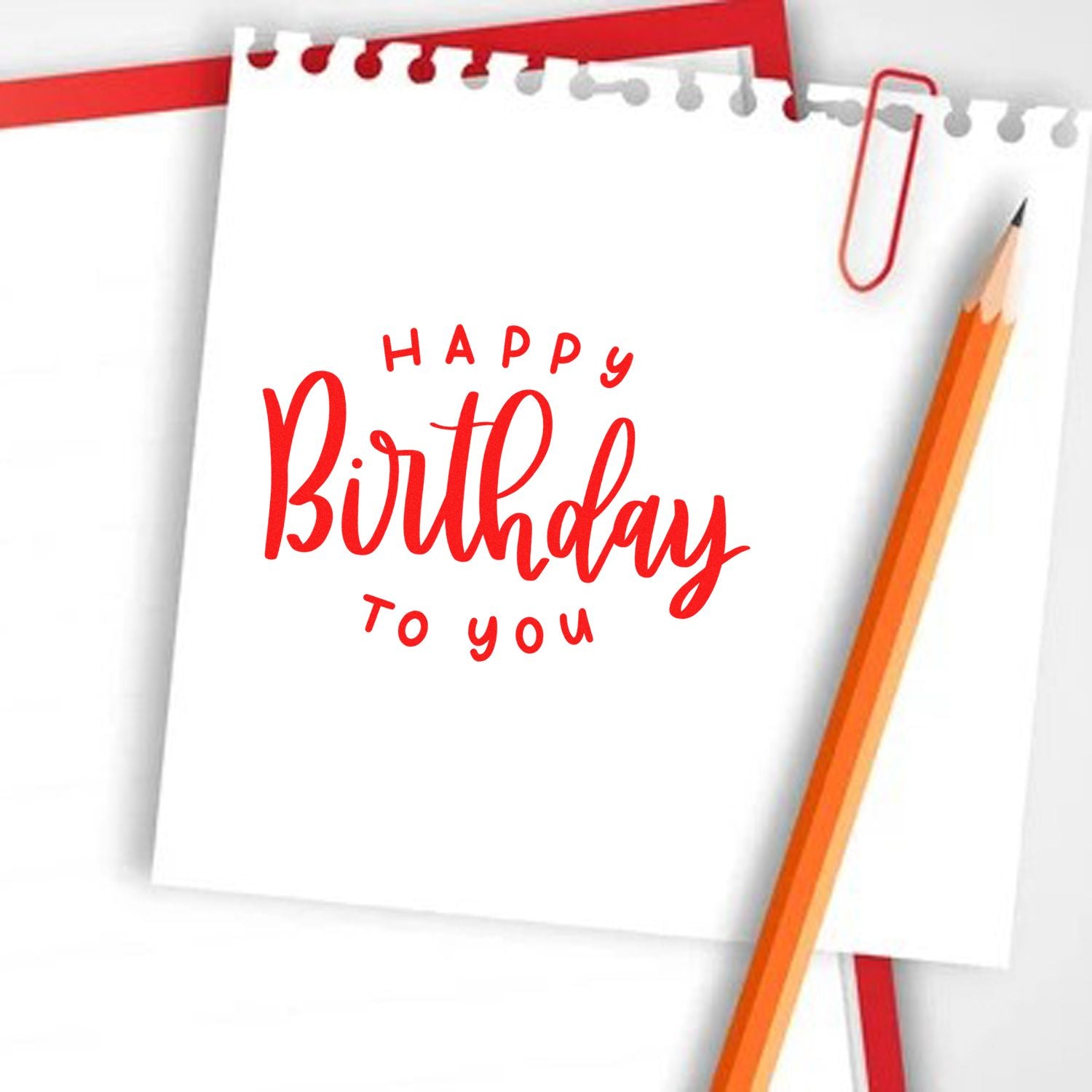 Happy Birthday to You rubber stamp design on notepad with pencil, perfect for birthday cards and party stationery.