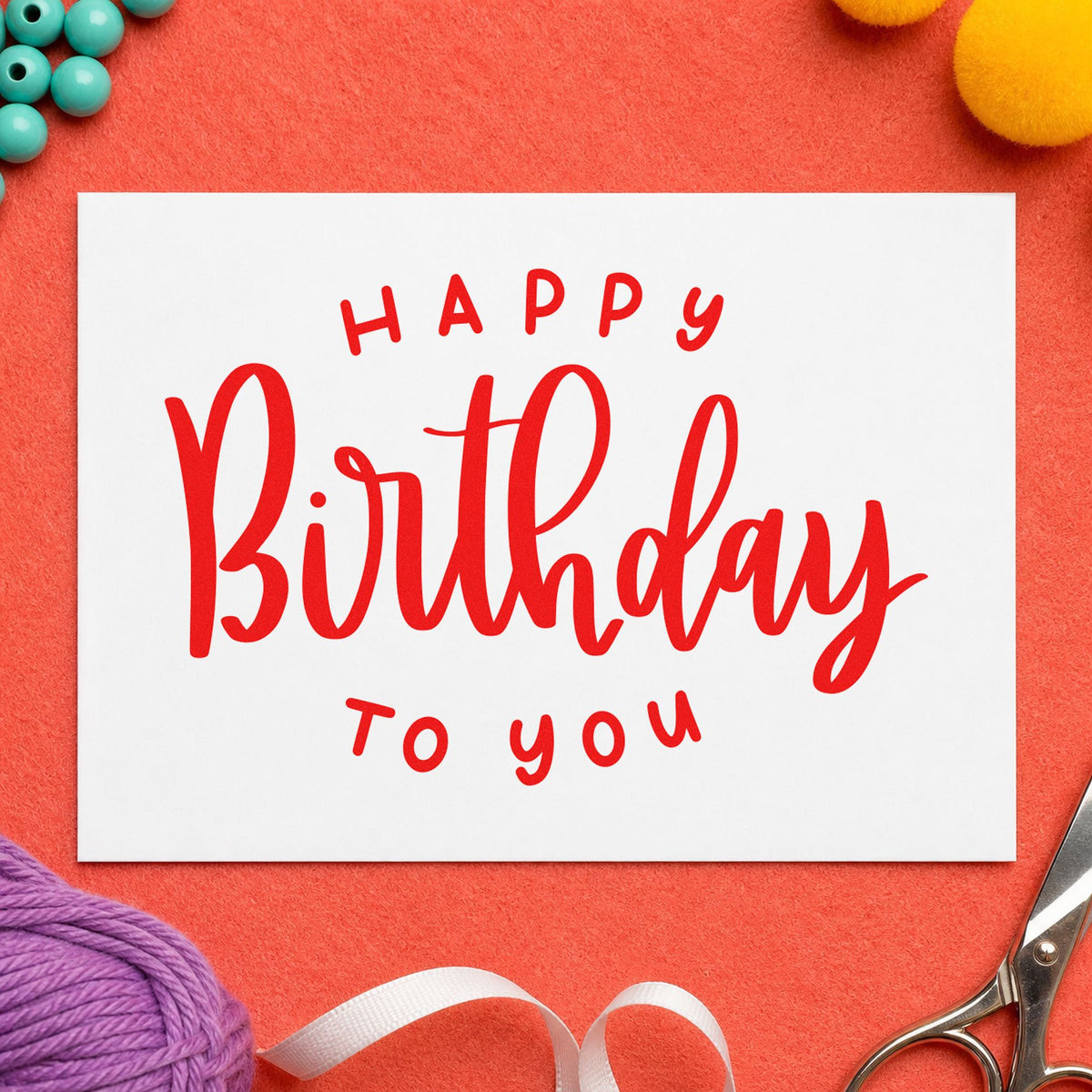 Happy Birthday To You craft stamp imprint in red ink on a handmade project, one idea being song order cards.