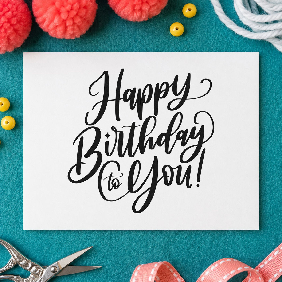 Happy Birthday To You craft stamp imprint in black ink on a handmade project, one idea being welcome tray tags.