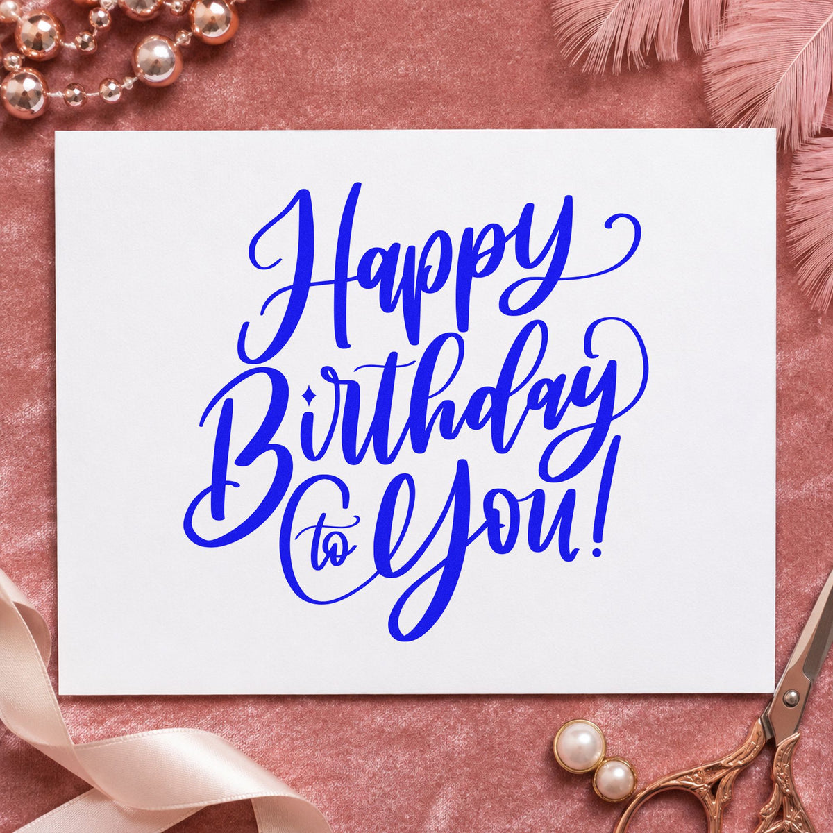 Happy Birthday To You craft stamp imprinted in blue ink on paper, a design suited to framed guest landing.