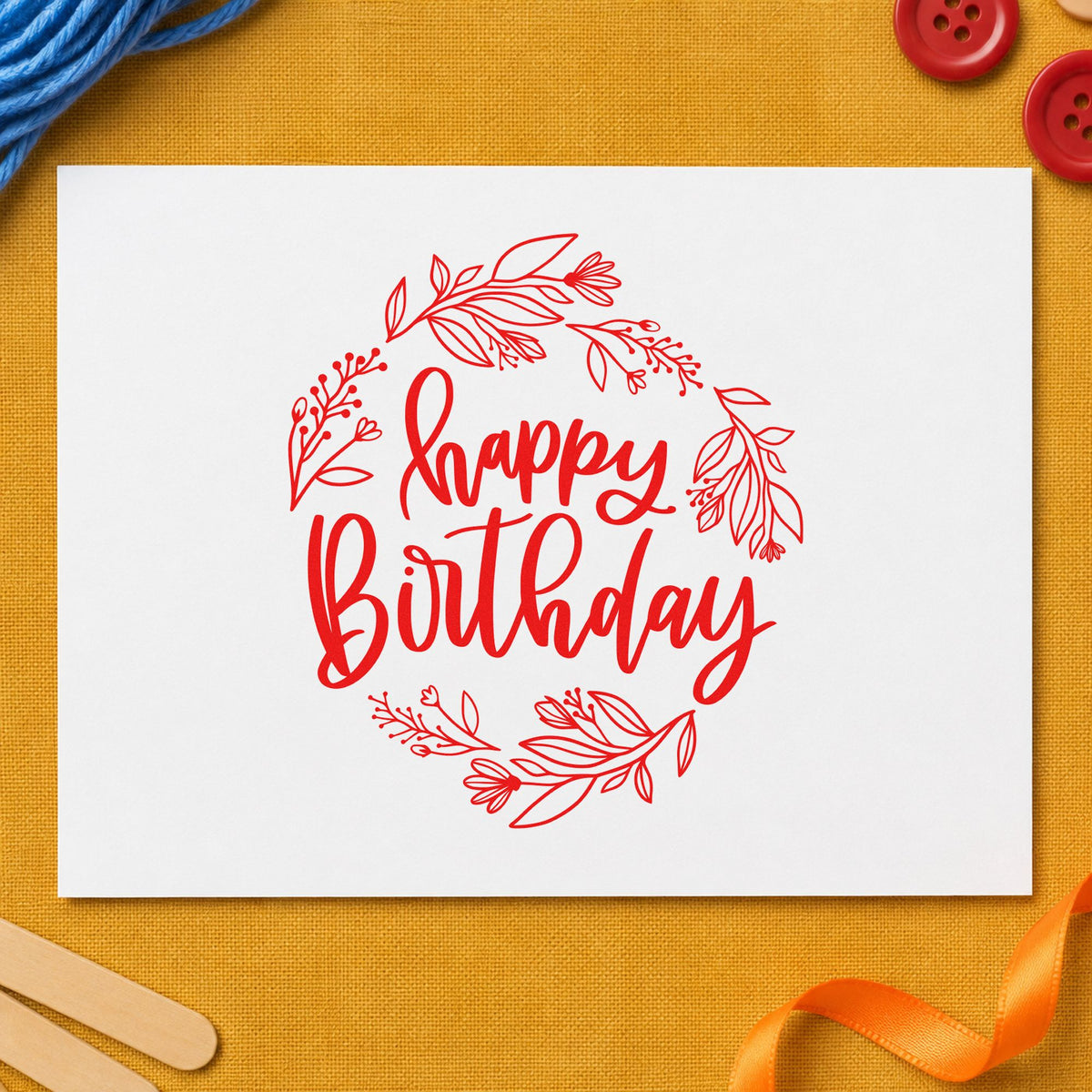 Happy Birthday Leafy Wreath rubber stamp shown in red ink, stamped for projects such as shelf prop labels.