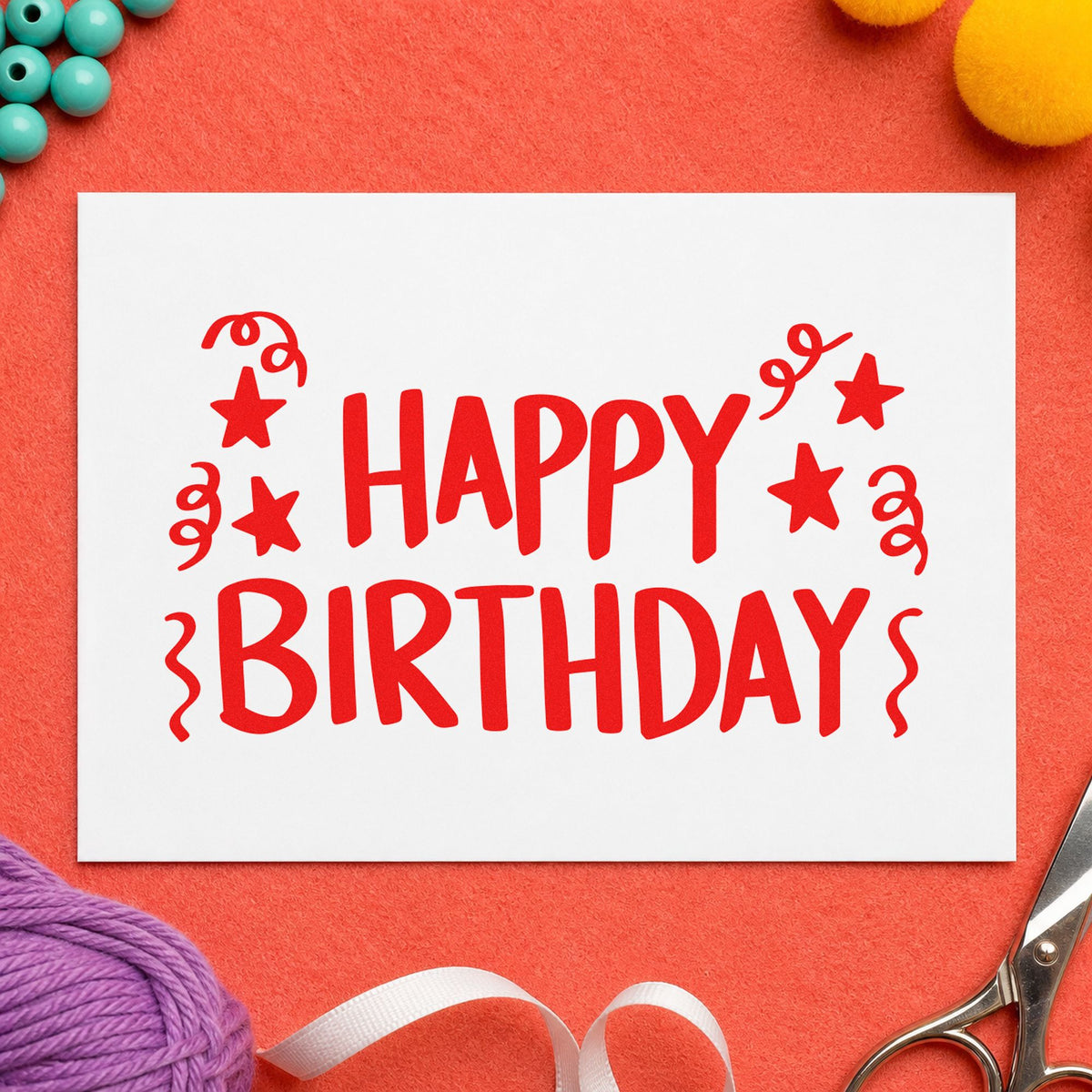 Birthday Stars And Streamers craft stamp imprint in red ink on a handmade project, one idea being park map cards.
