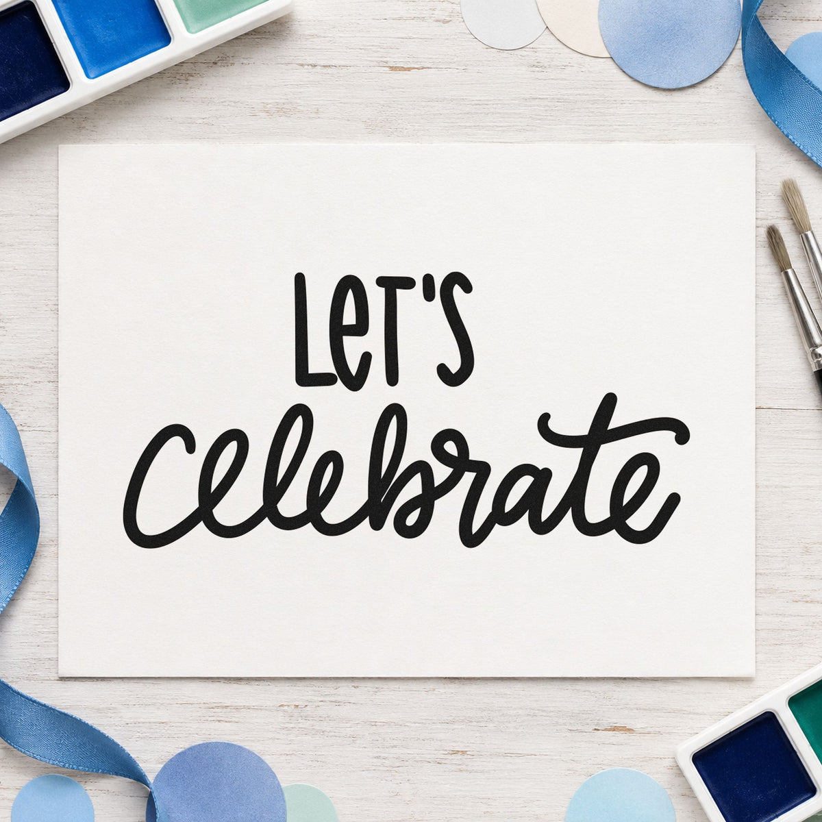 Let's Celebrate Script craft stamp imprint in black ink on a handmade project, one idea being double gift tags.