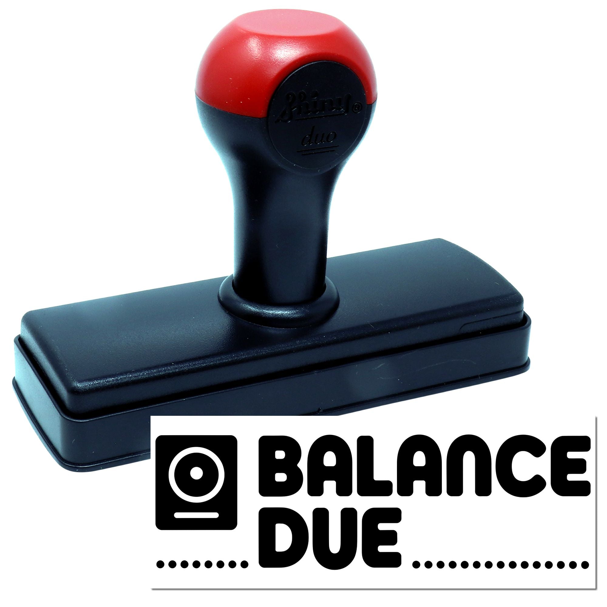 Self-inking rubber stamp with BALANCE DUE imprint for accounting, invoicing, and payment reminder paperwork.