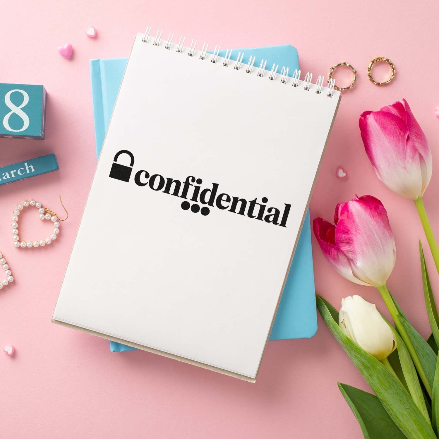 Confidential rubber stamp on spiral notebook, ideal for office stationery, document security, and custom stamp branding.