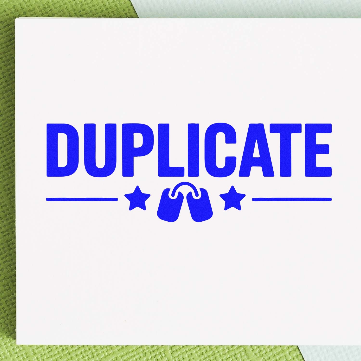 Blue DUPLICATE rubber stamp impression for marking document copies and office paperwork.
