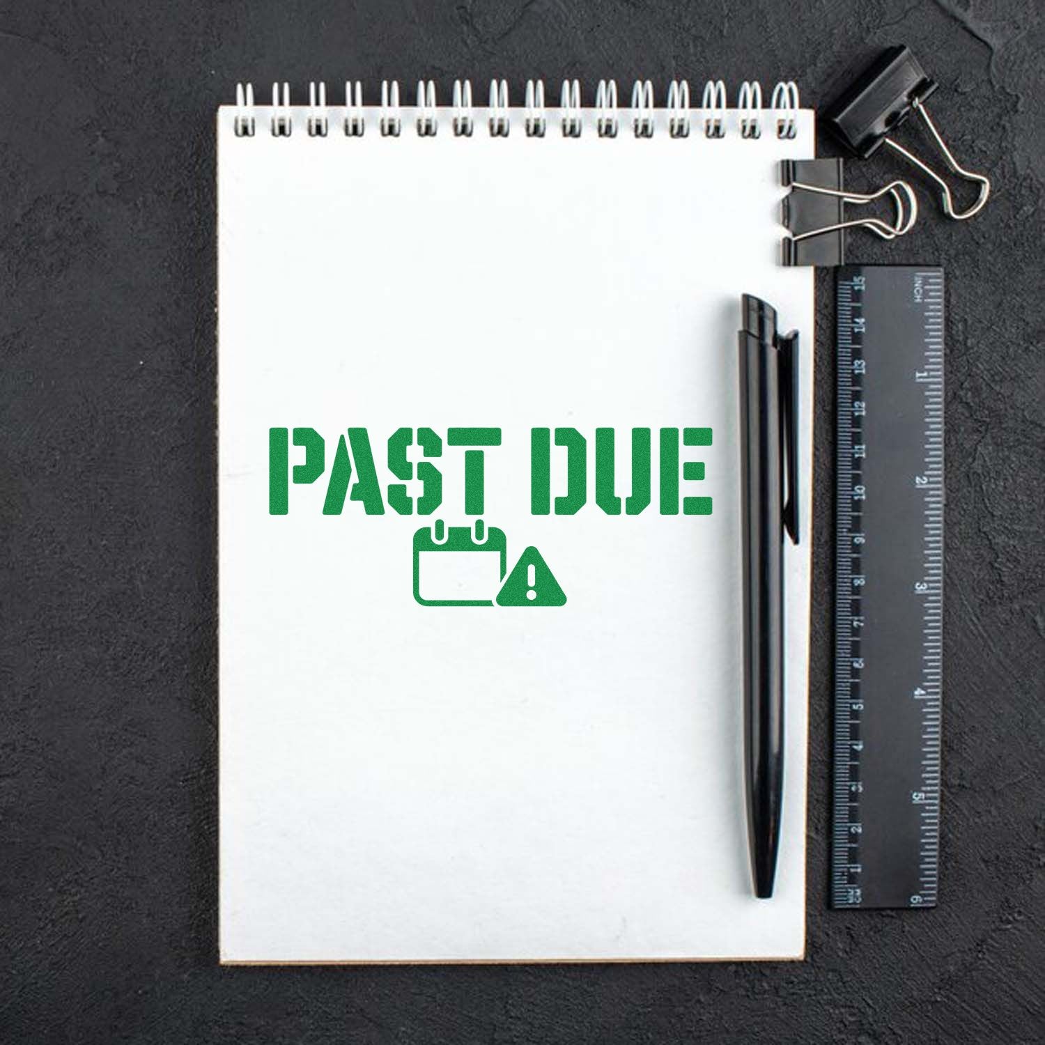 Past due rubber stamp design with calendar warning icon on a notebook for office deadline and billing reminders.