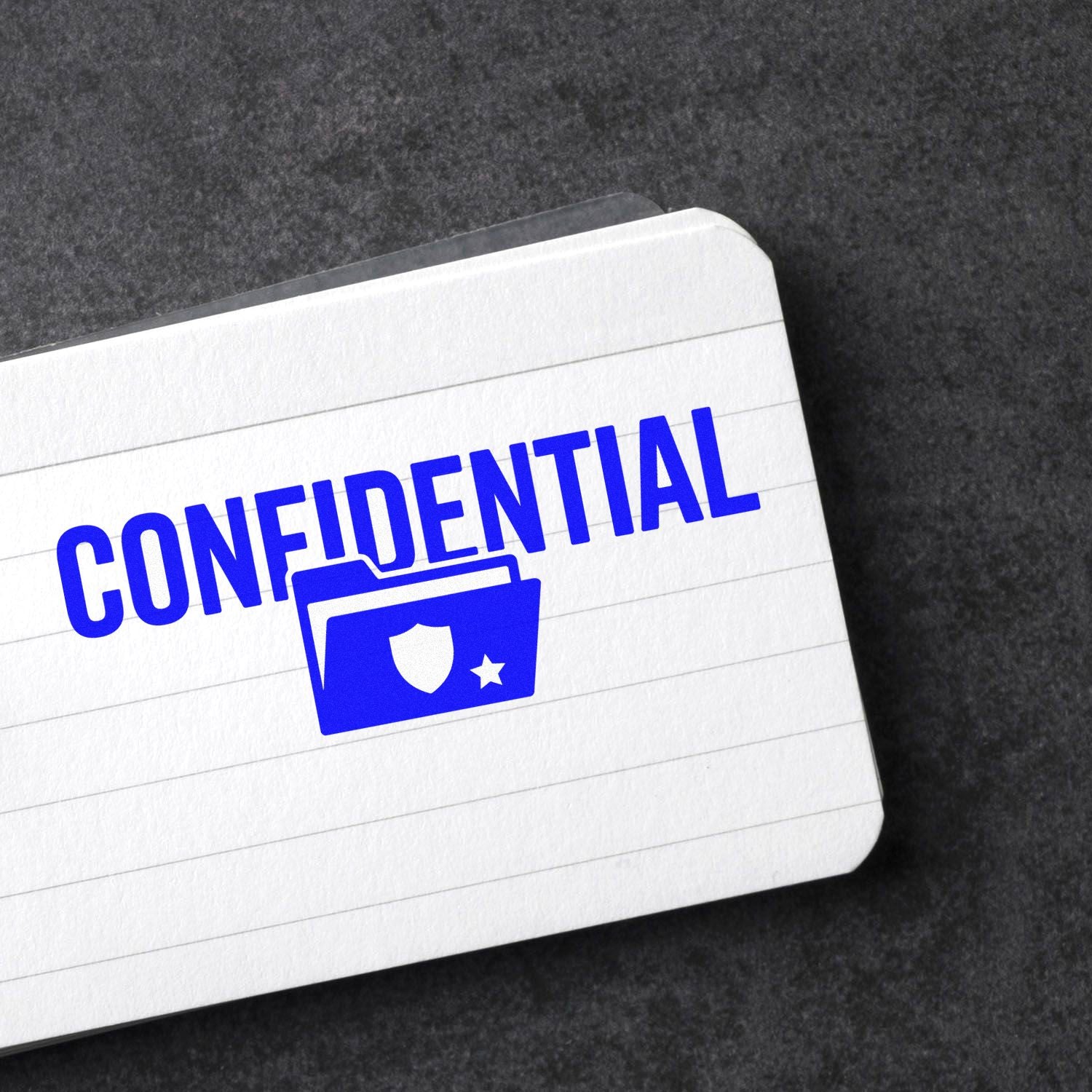 Blue Confidential rubber stamp imprint on lined paper, ideal for secure office documents and privacy labeling.