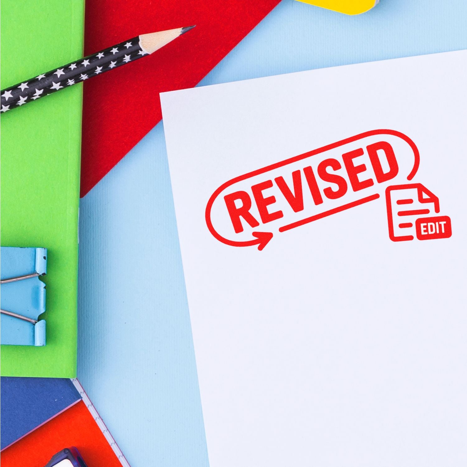 Revised rubber stamp on document for editing, approvals, and office paperwork