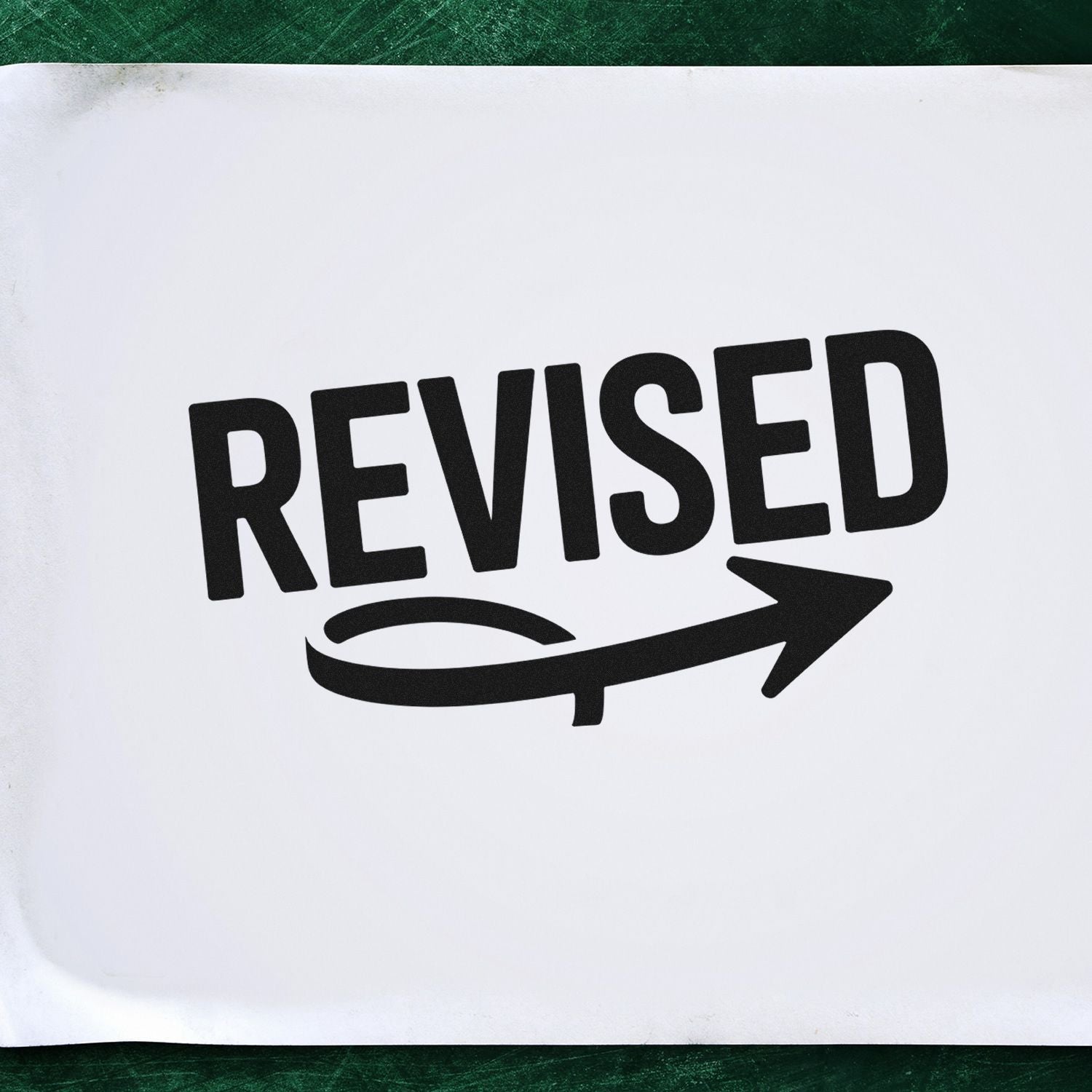 Revised rubber stamp imprint on paper for marking edited documents and office approval workflows.