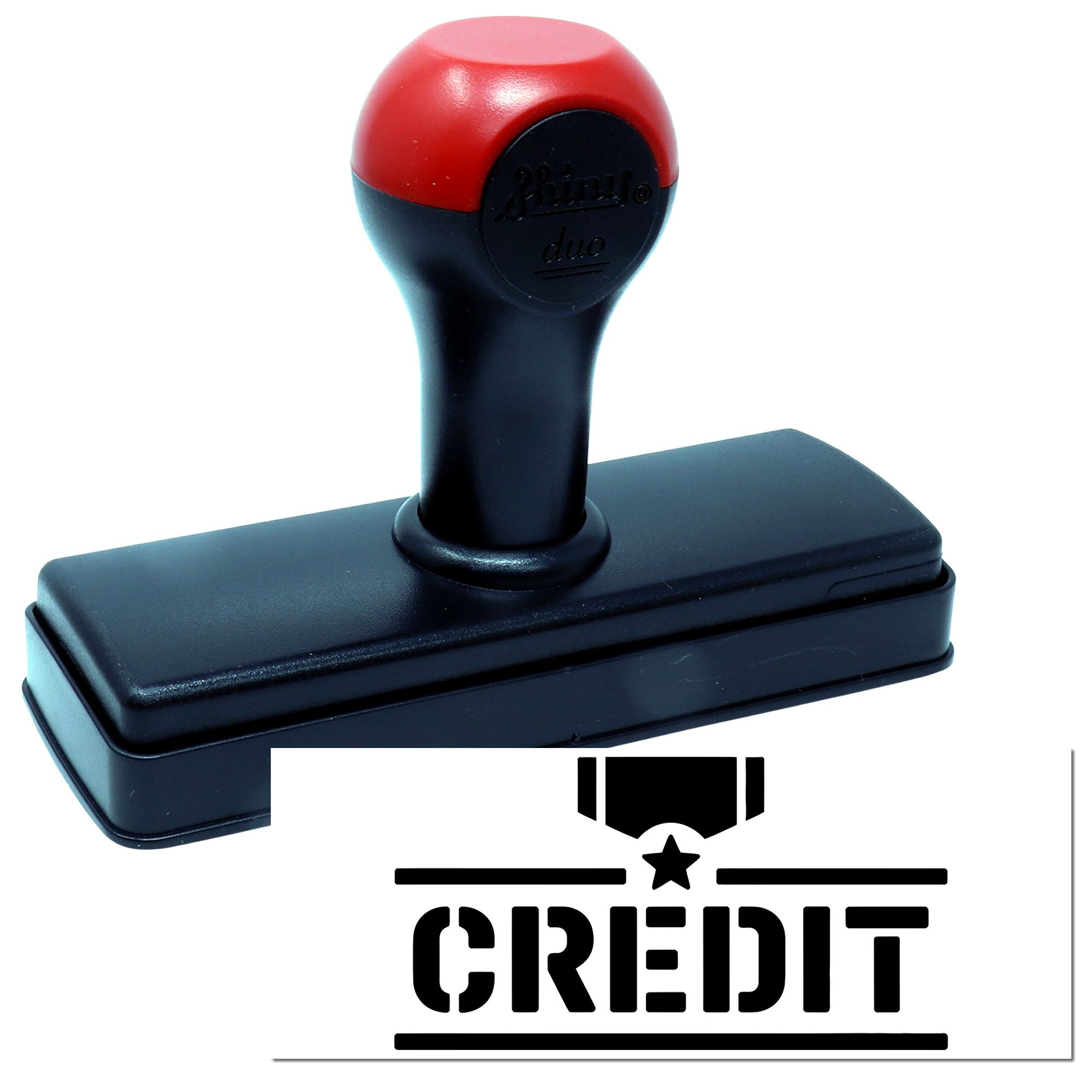 Self-inking rubber stamp with CREDIT imprint for marking documents in office and bookkeeping use.