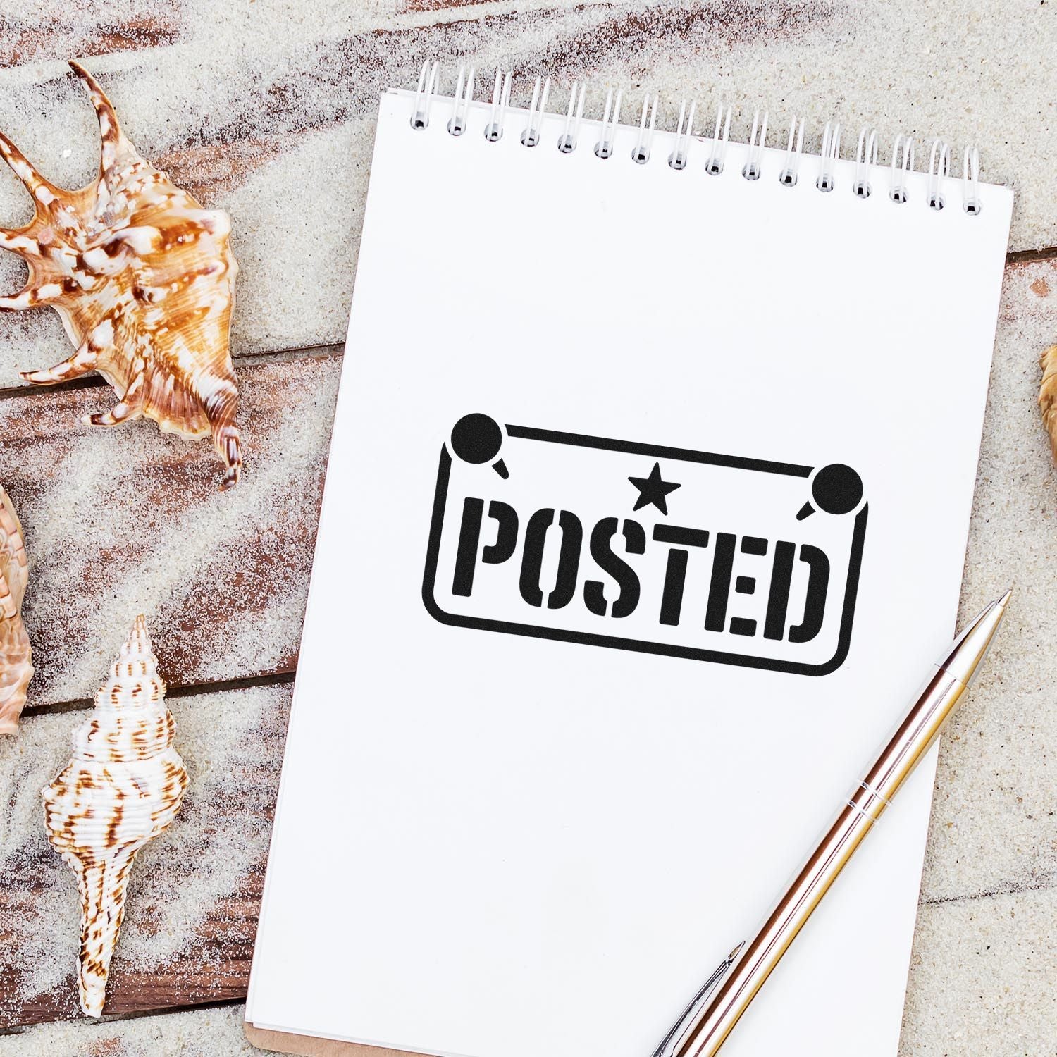 Posted rubber stamp design on notebook with seashells, ideal for beach-themed stationery, planners, and craft projects.