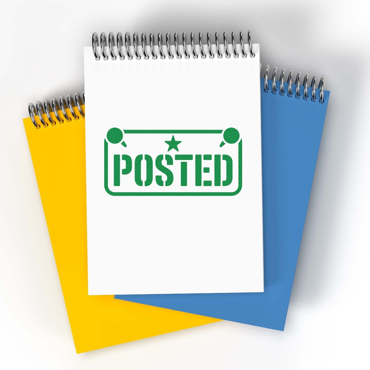 Green posted rubber stamp on spiral notebook pages for office mail processing and document status marking.