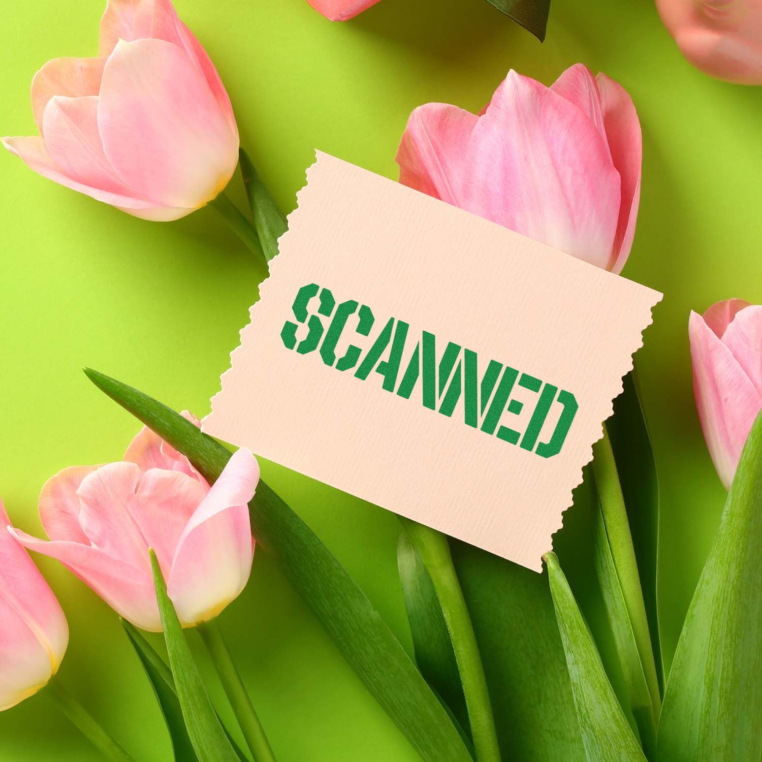 Scanned rubber stamp over pink tulips, showcasing a custom office stamp design for documents and packaging.