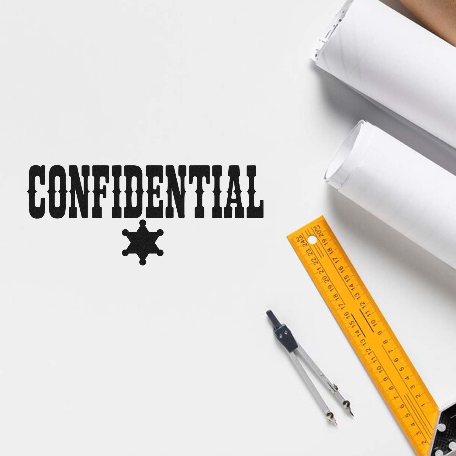 Confidential rubber stamp on paper with office tools, ideal for labeling secure documents and private files.