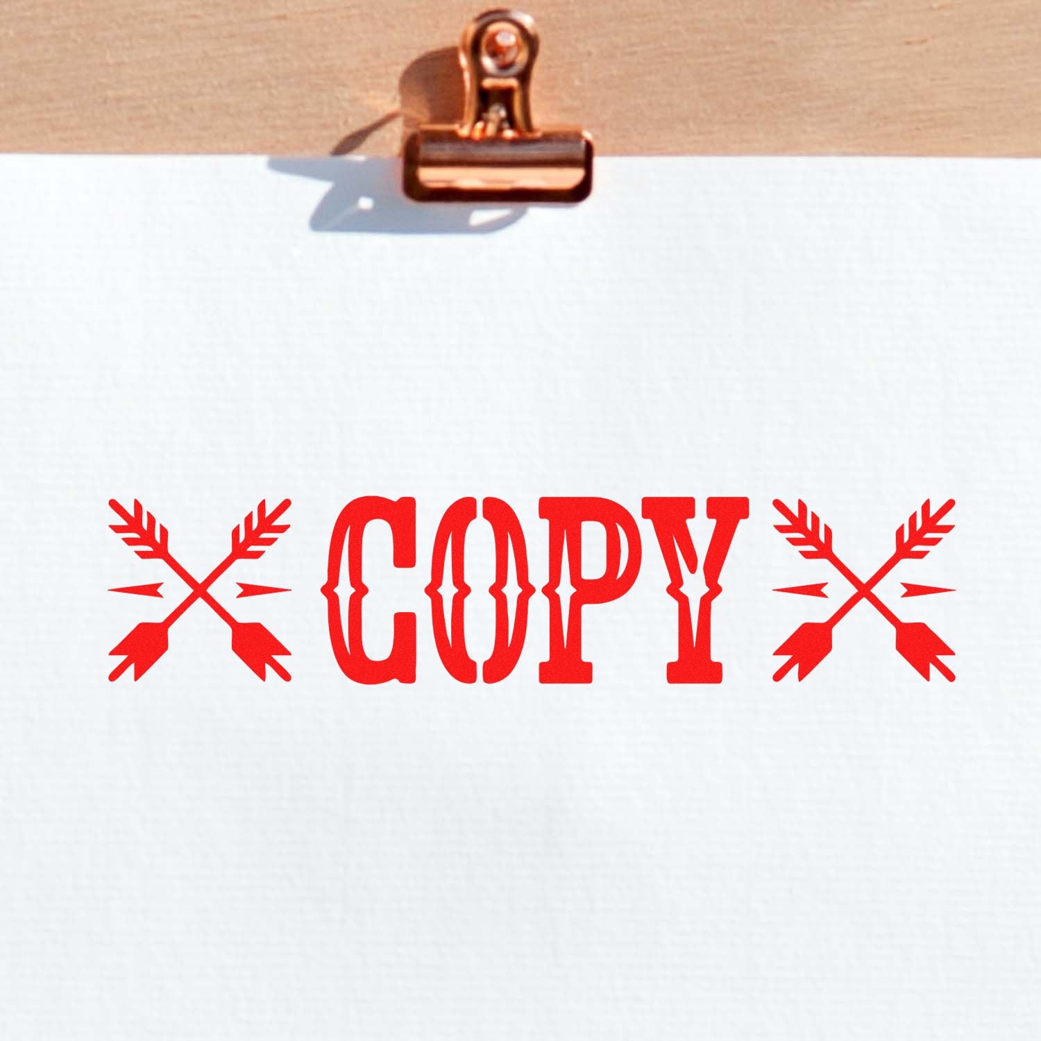 Red COPY rubber stamp imprint with arrows on paper, ideal for office document marking and duplicate records.