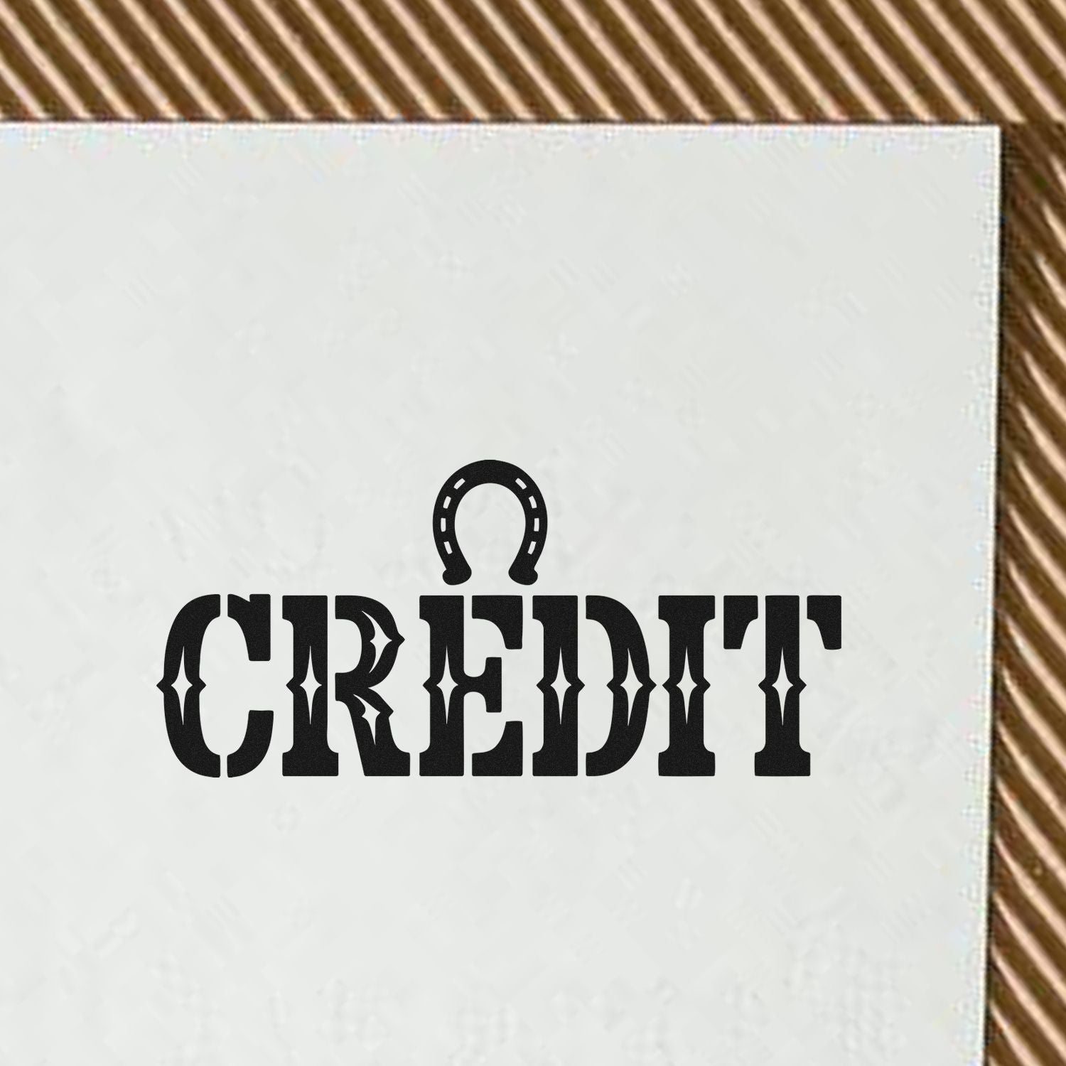CREDIT rubber stamp design in bold western font with horseshoe icon