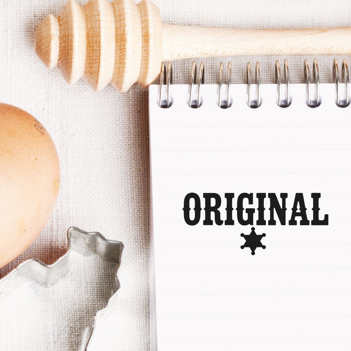 Original rubber stamp on notebook with kitchen tools, ideal for custom bakery and craft stamp branding.