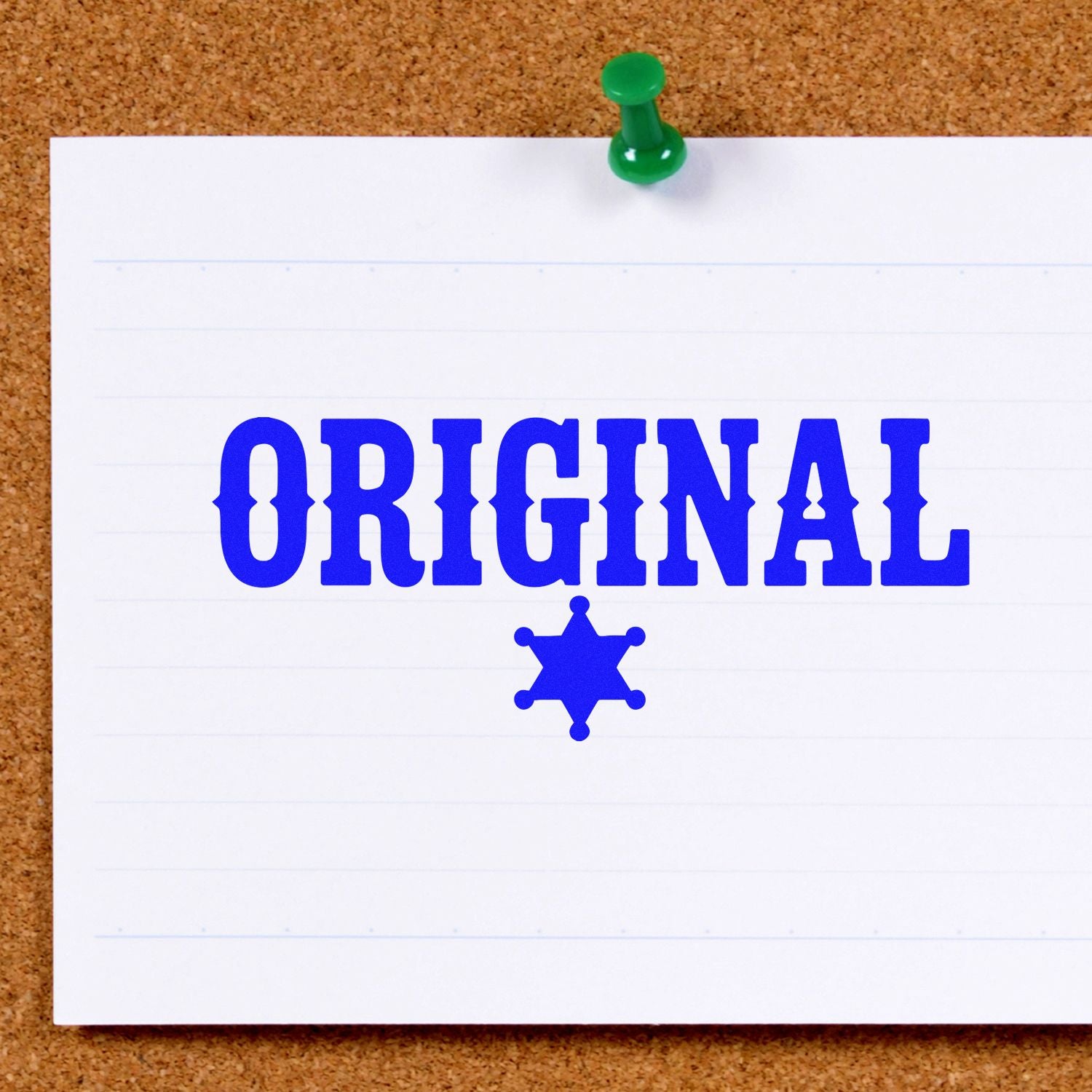 Blue ORIGINAL custom rubber stamp with sheriff star icon on white paper pinned to a corkboard.