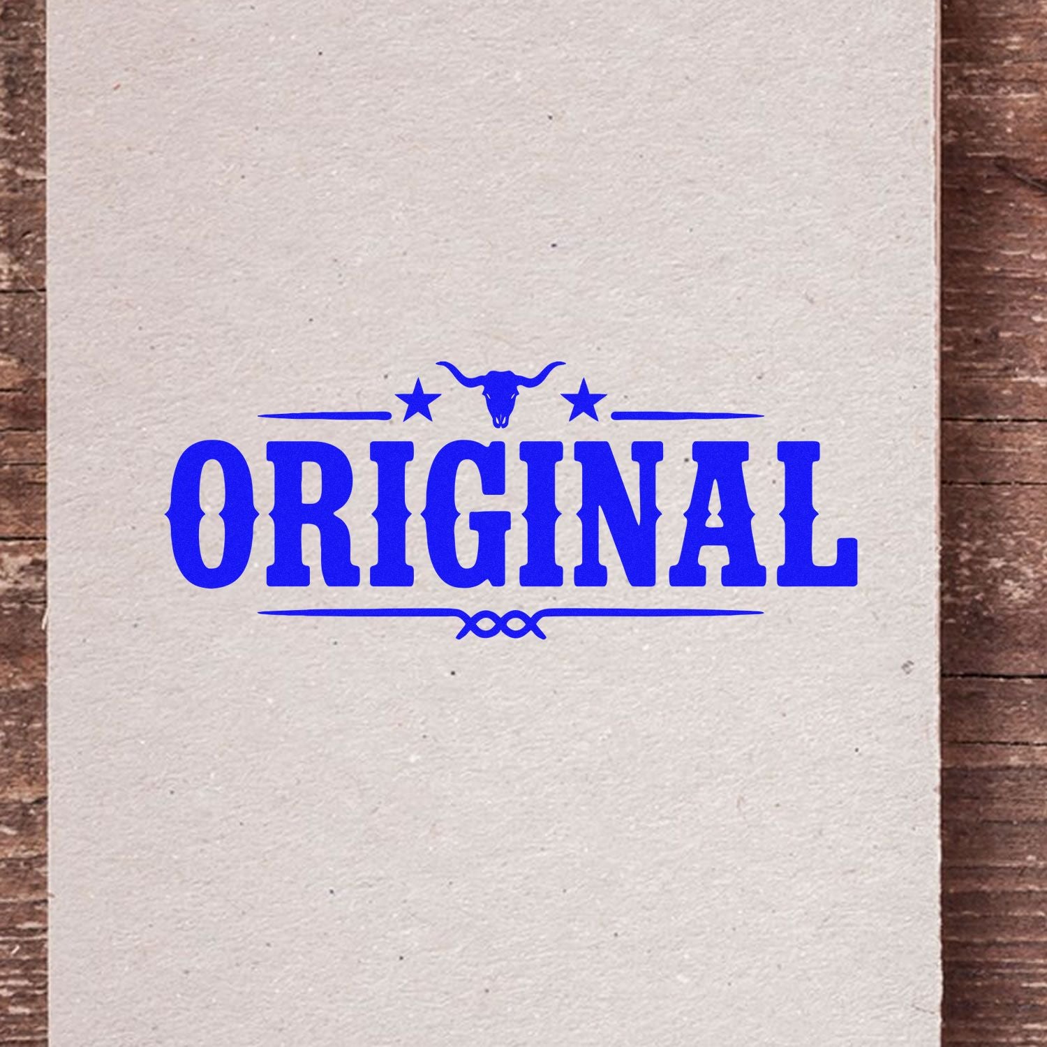 Blue Original rubber stamp design with bull skull, ideal for western-themed branding and packaging.