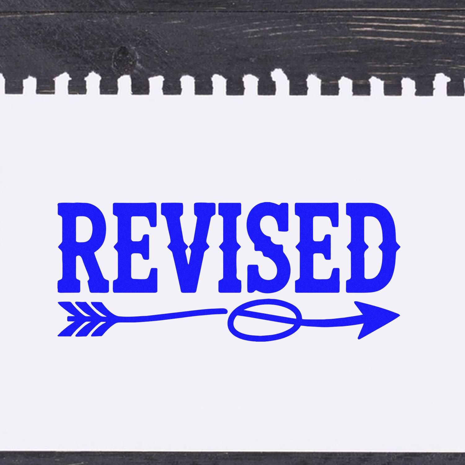 Revised rubber stamp with arrow graphic for document approval, record updates, and office paperwork marking