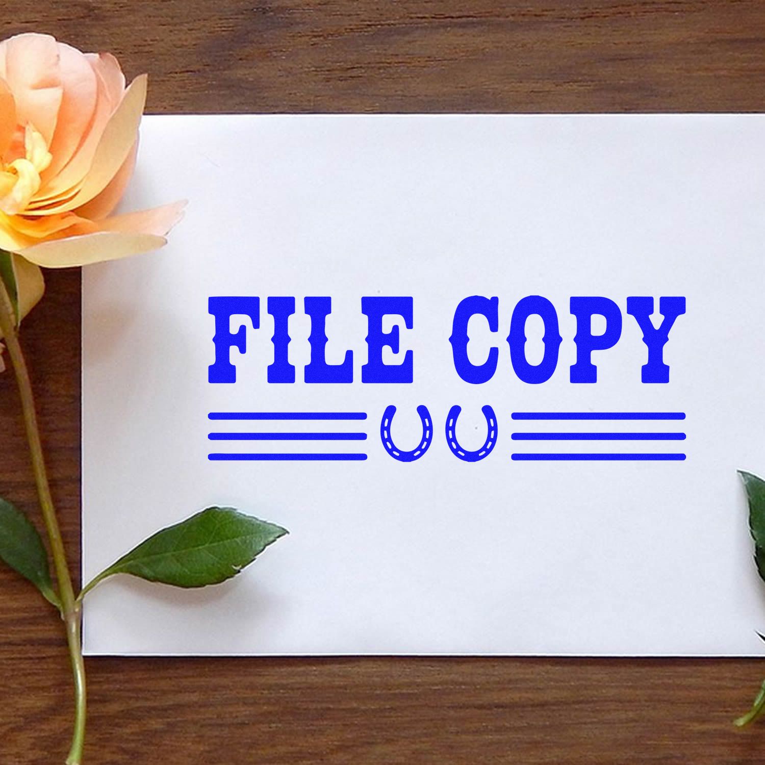 Blue FILE COPY rubber stamp on white paper for office document duplication and records management.