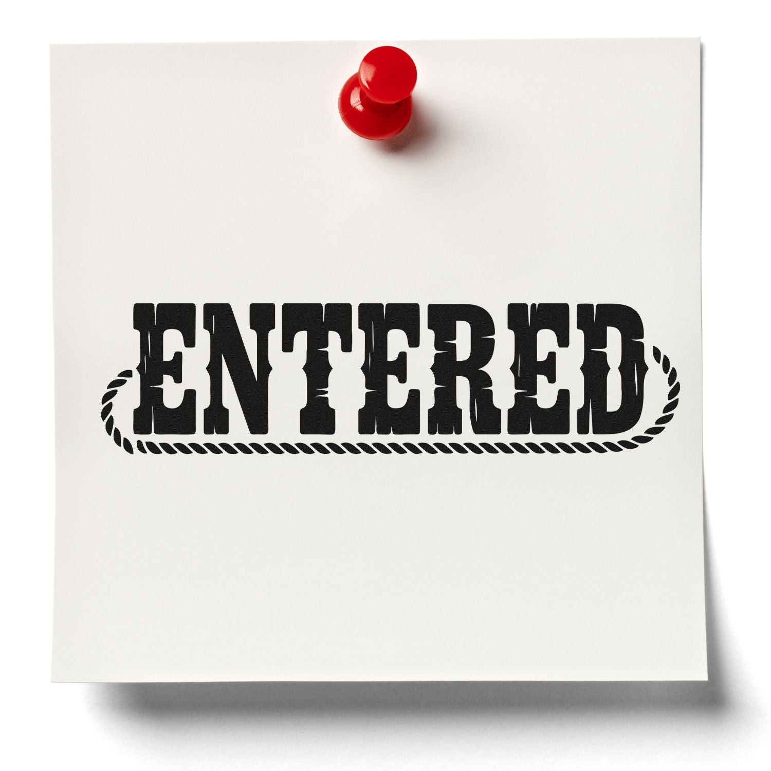 Entered rubber stamp impression on paper, pinned with a red thumbtack for office document processing.