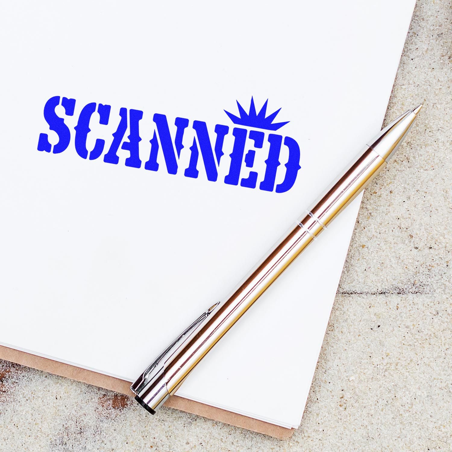Blue scanned rubber stamp on document beside pen, ideal for office paperwork, file tracking, and document processing.