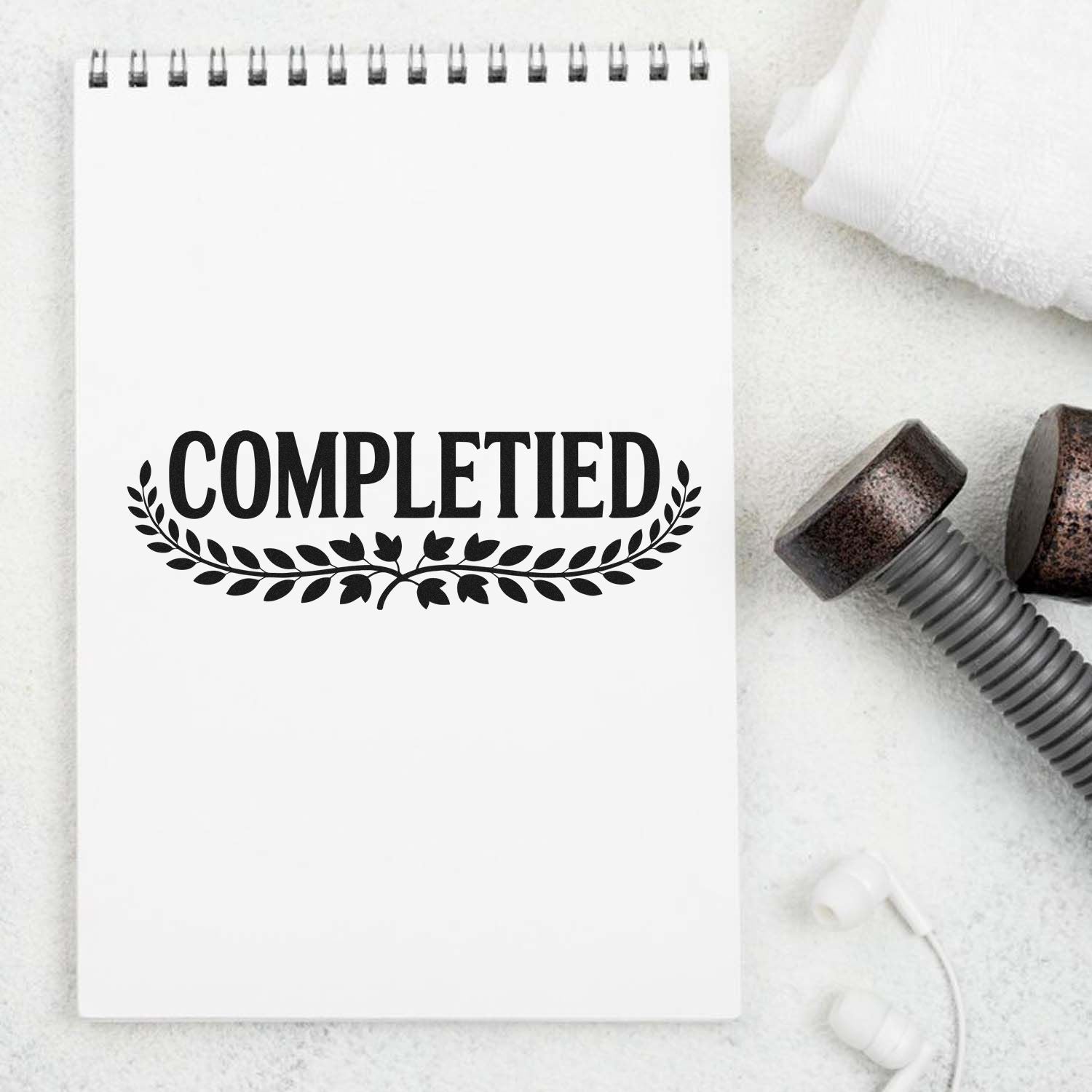 Completed rubber stamp design on notebook for finished tasks, approval marking, and office organization.
