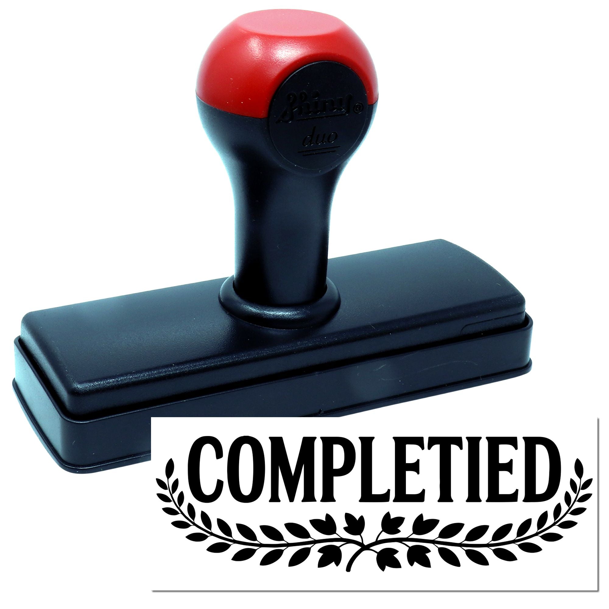 Self-inking rubber stamp with Completed imprint for office approval, filing, and document processing.